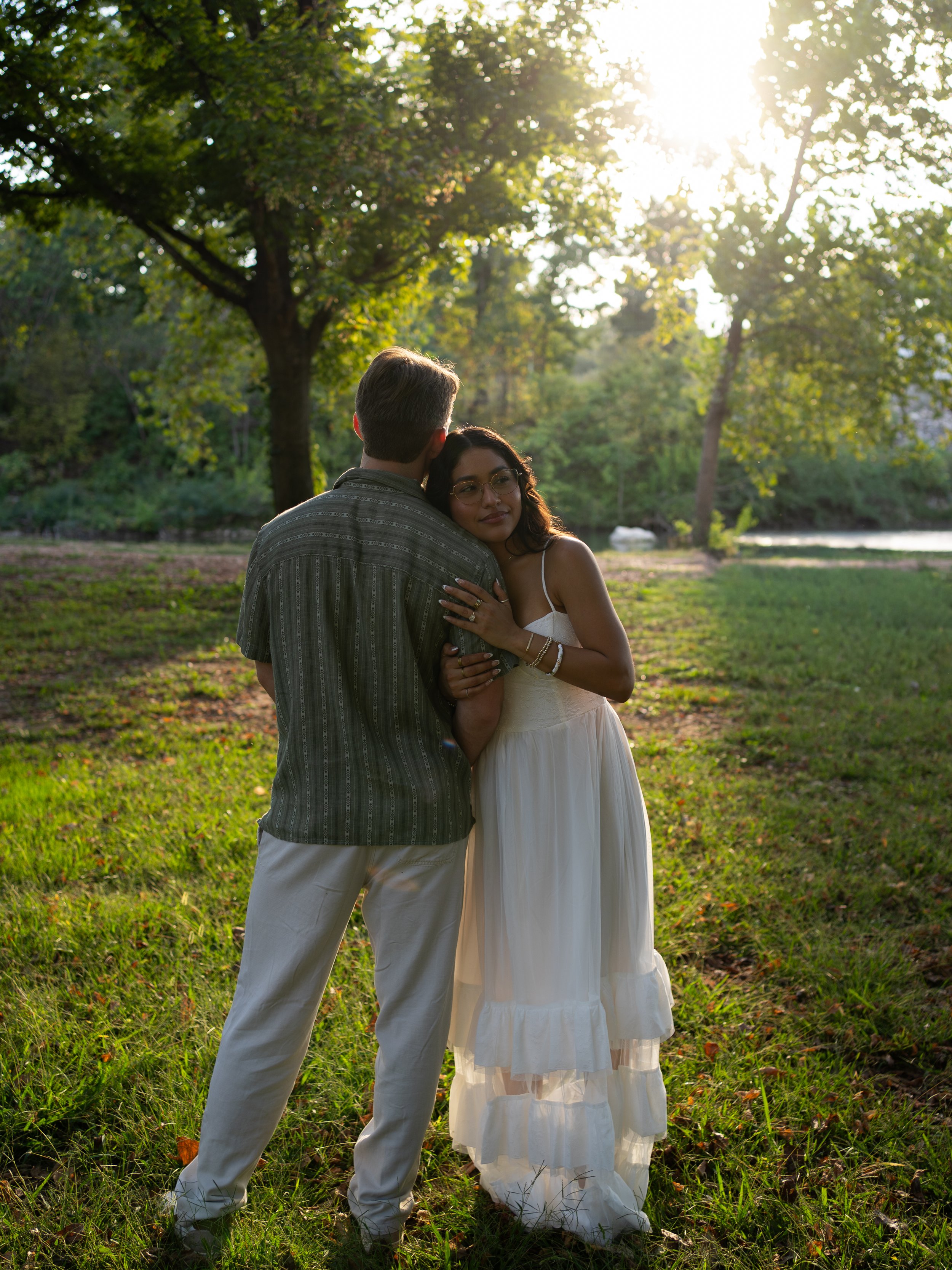 A warm golden-hour portrait in Mammoth Springs, AR, highlighting connection and natural light.