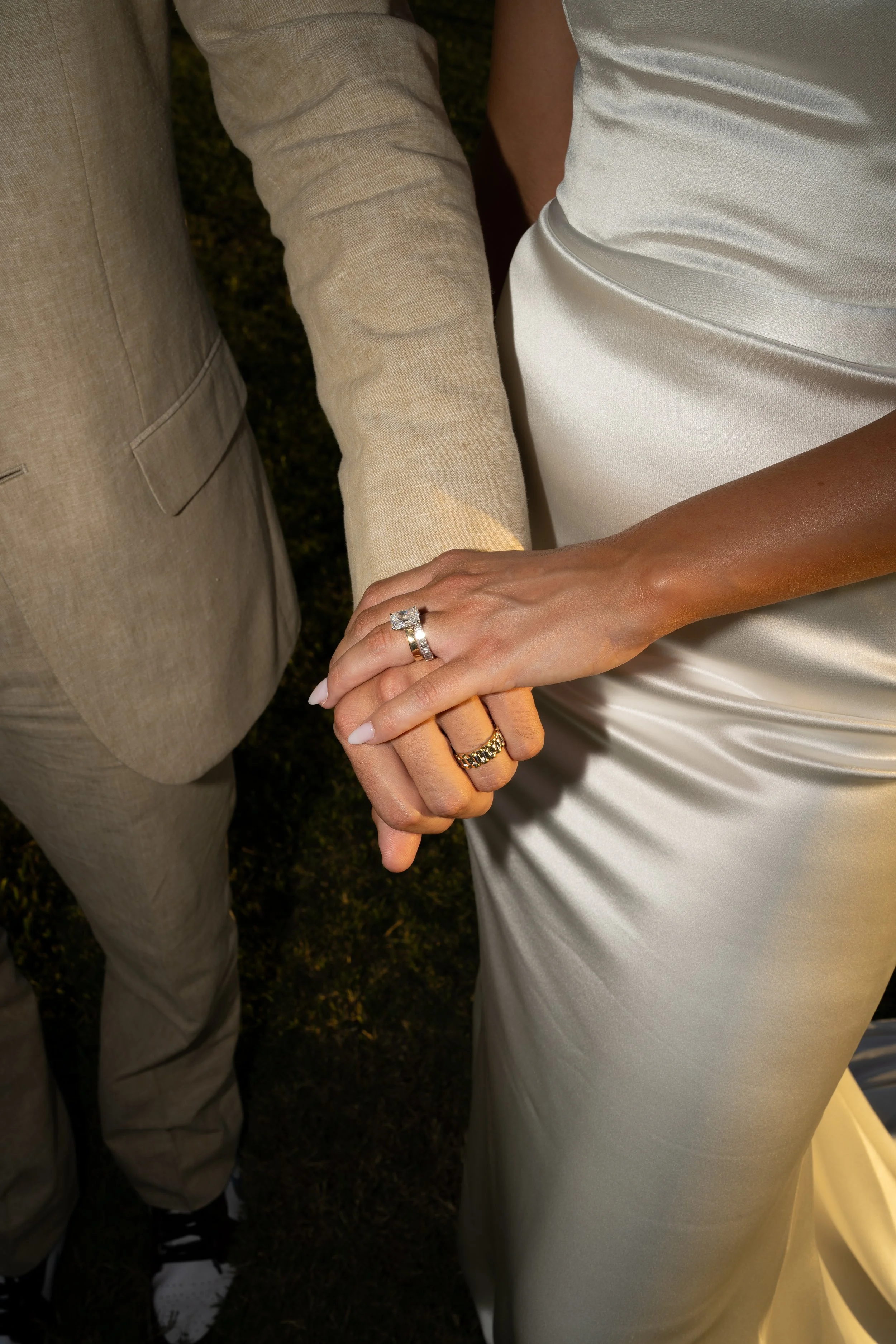 Close-up of hands and wedding attire details captured during a backyard wedding in Fort Worth, Texas.