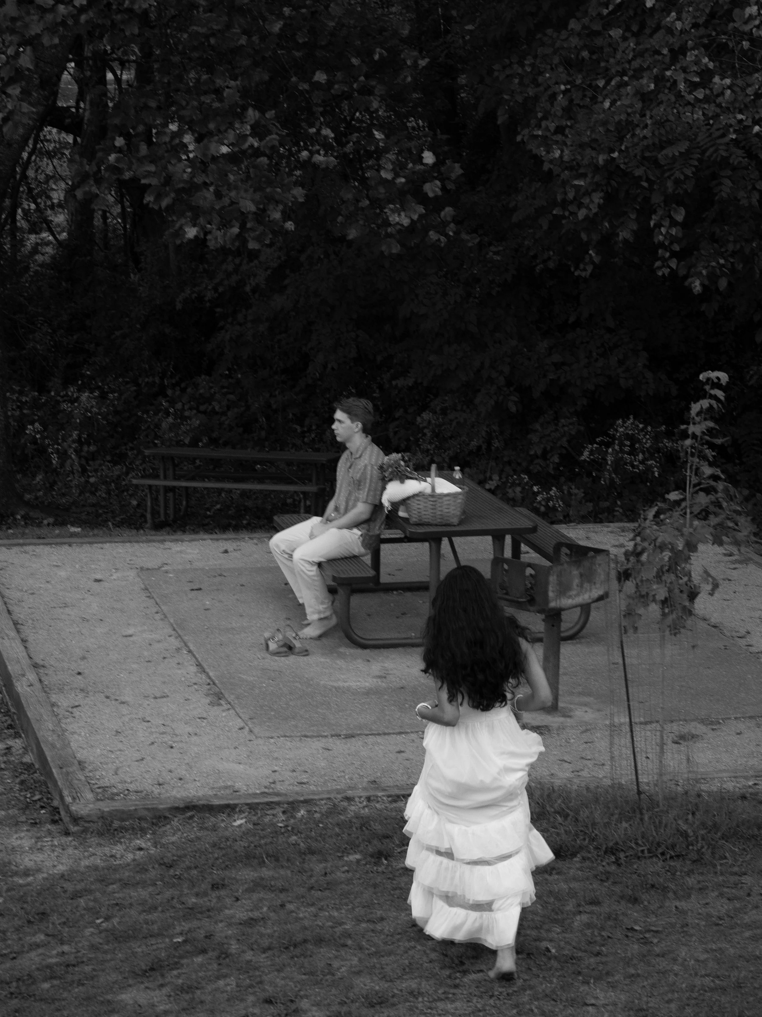 A storytelling-driven moment in Mammoth Spring, Arkansas, capturing interaction and personality from a distance.
