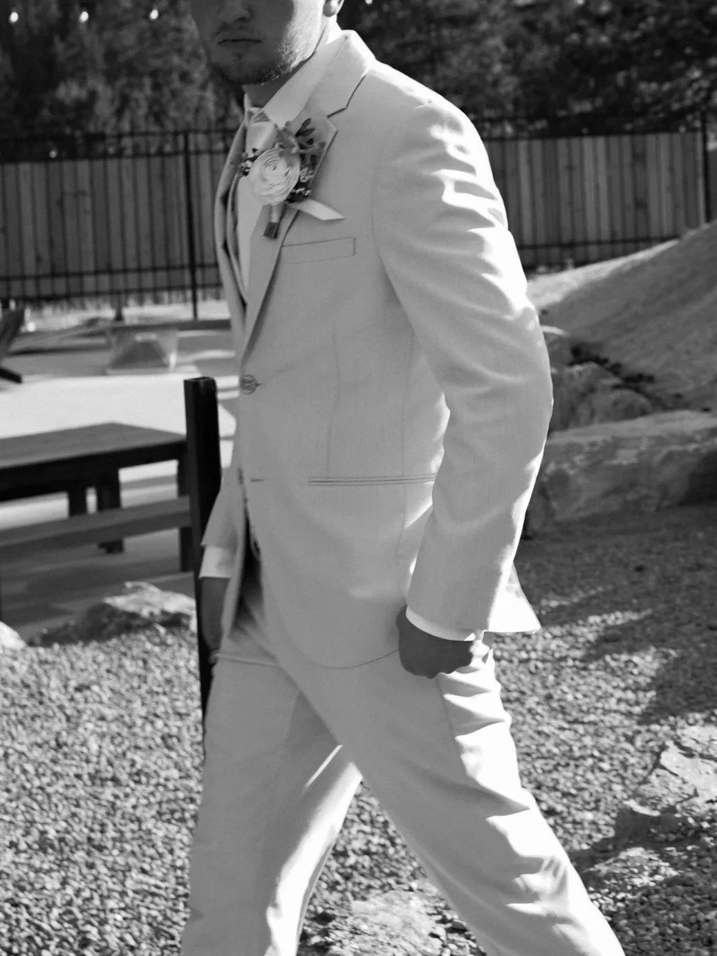 Groom walking candid in suite during a scenic wedding in Pine, Colorado.