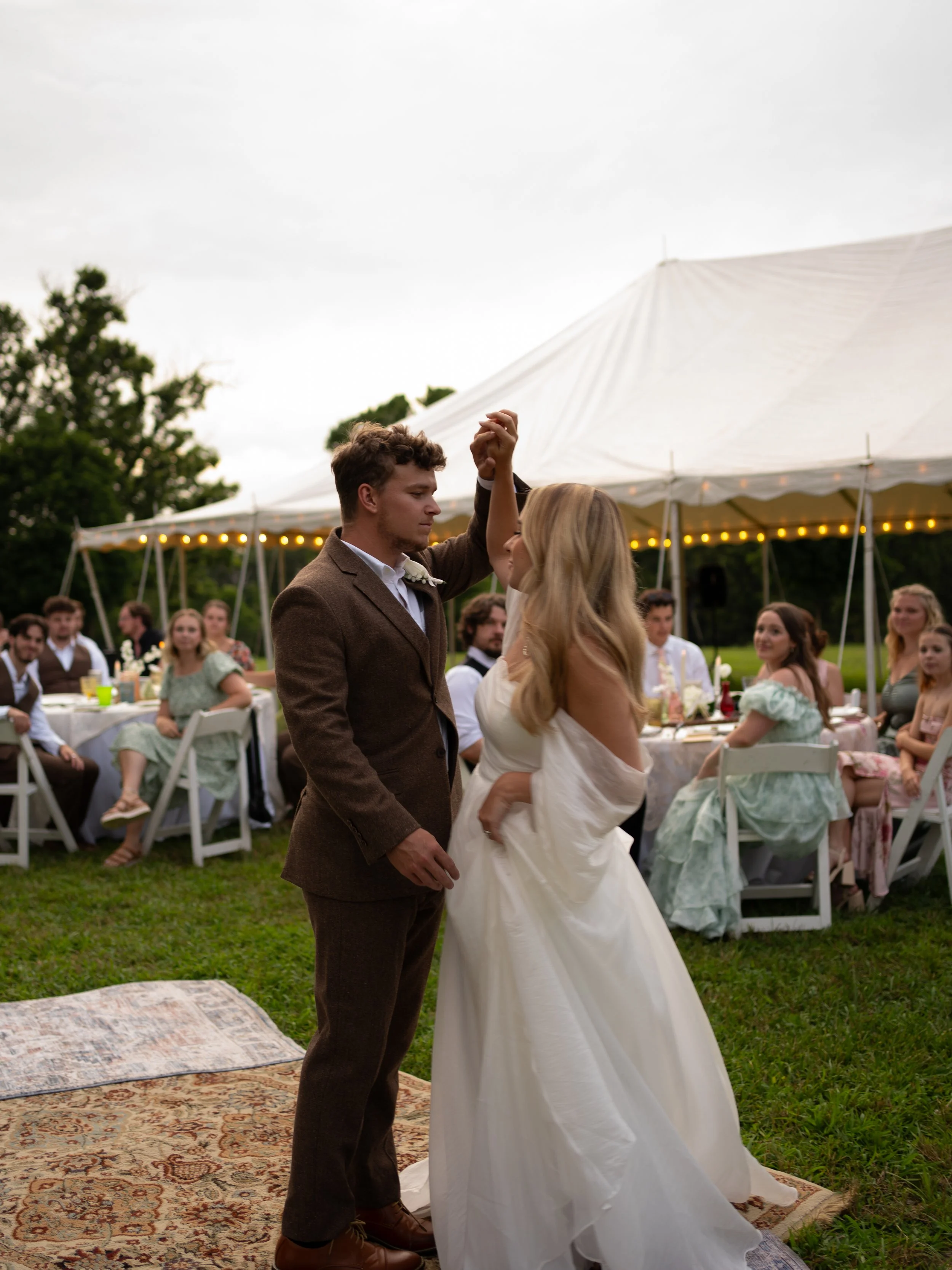 Bride and groom first dance at backyard wedding reception