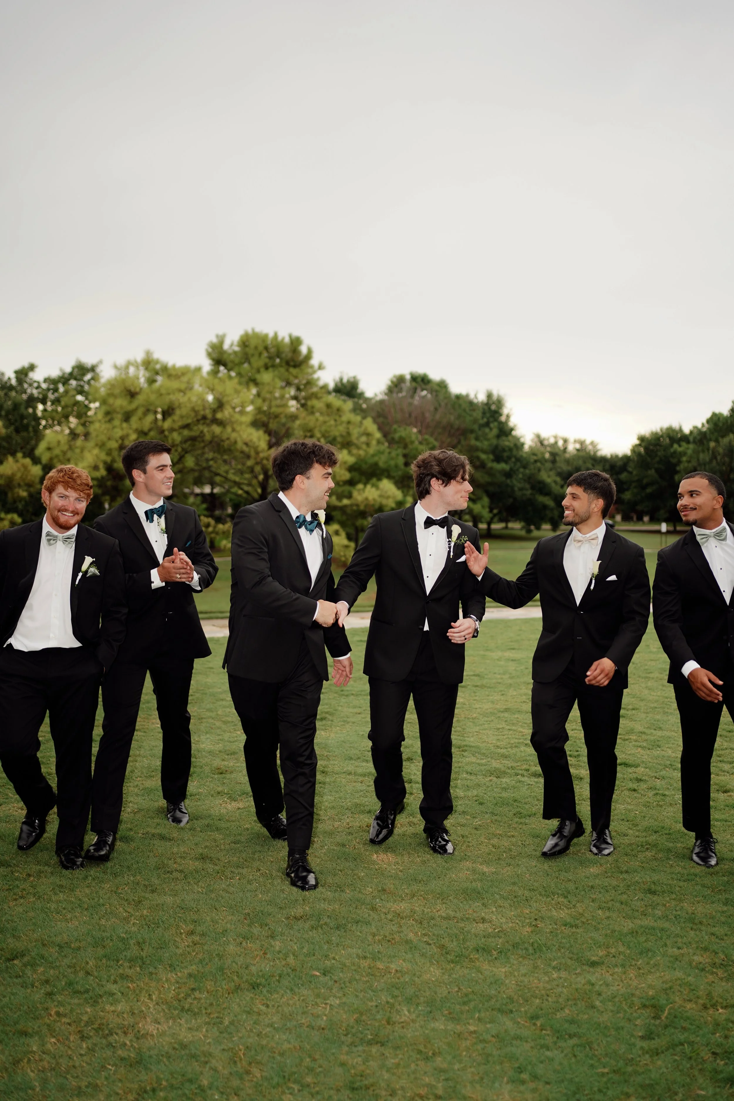 A relaxed and energetic groomsmen moment in Richmond, Texas, capturing personality and natural movement.