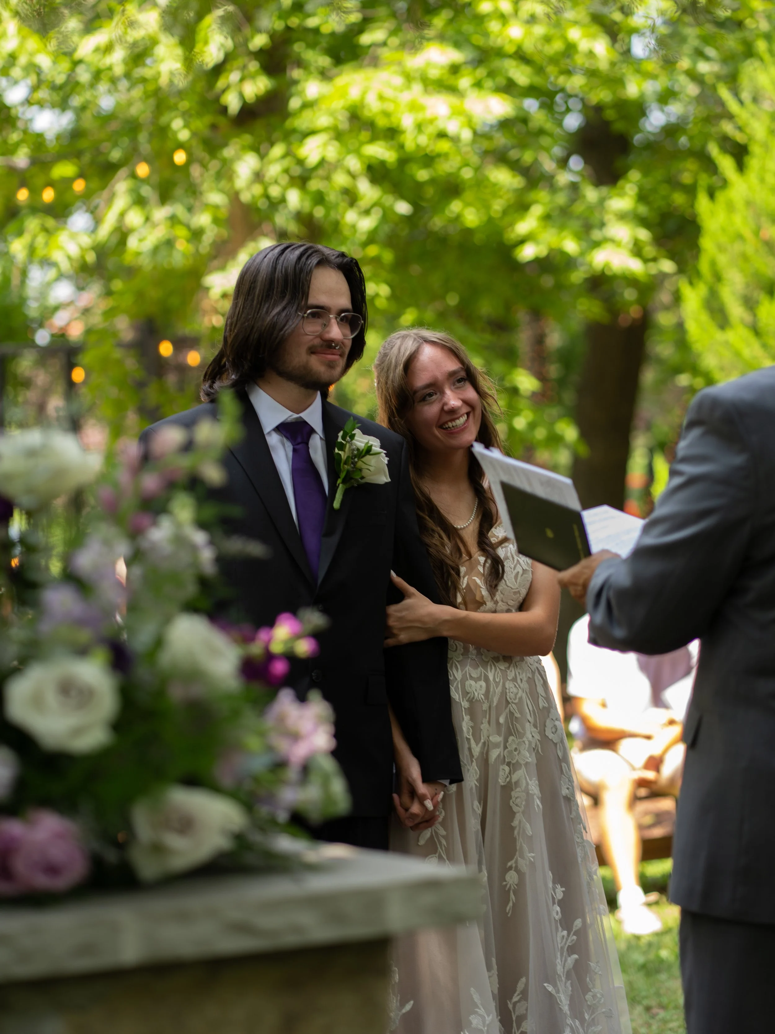 A candid ceremony moment in O’Fallon, MO, capturing genuine emotion and connection among guests.