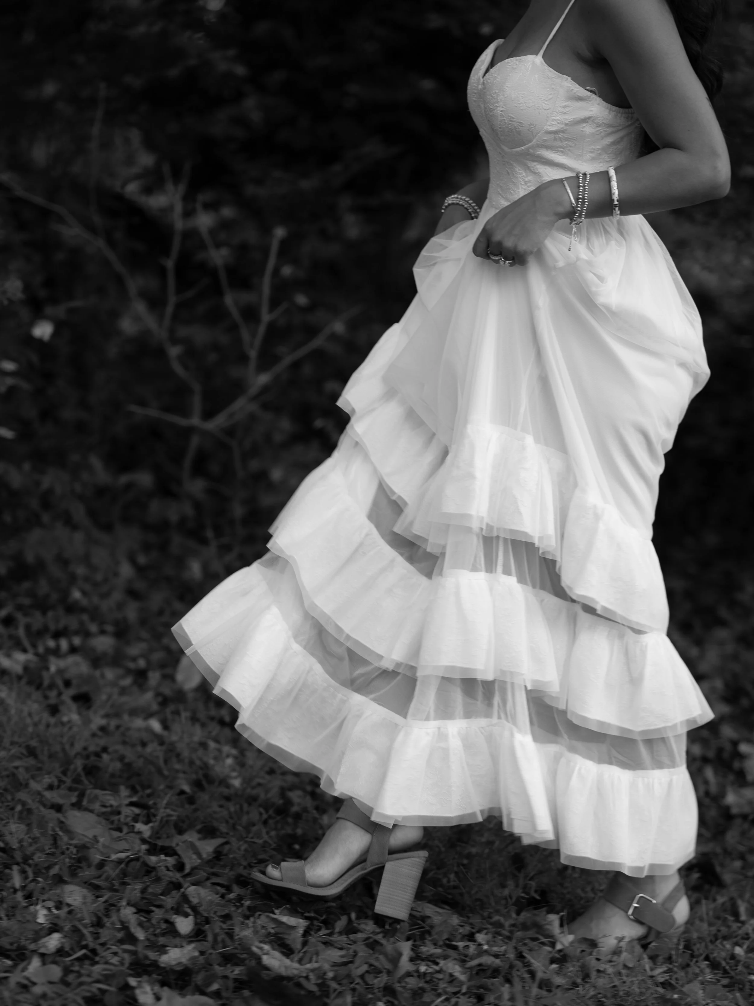 A close-up black-and-white detail in Mammoth Spring, Arkansas, highlighting texture and movement within the dress.