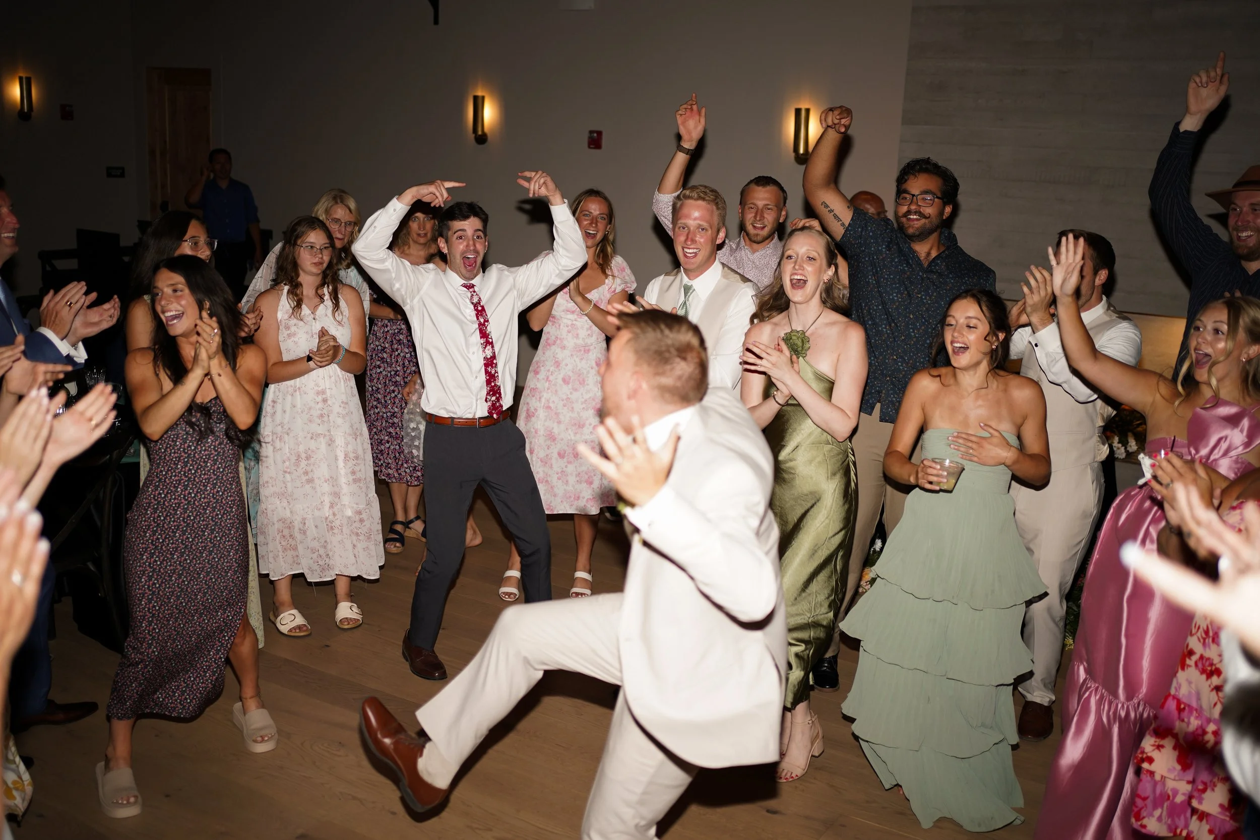 Candid wedding reception celebration with guests
