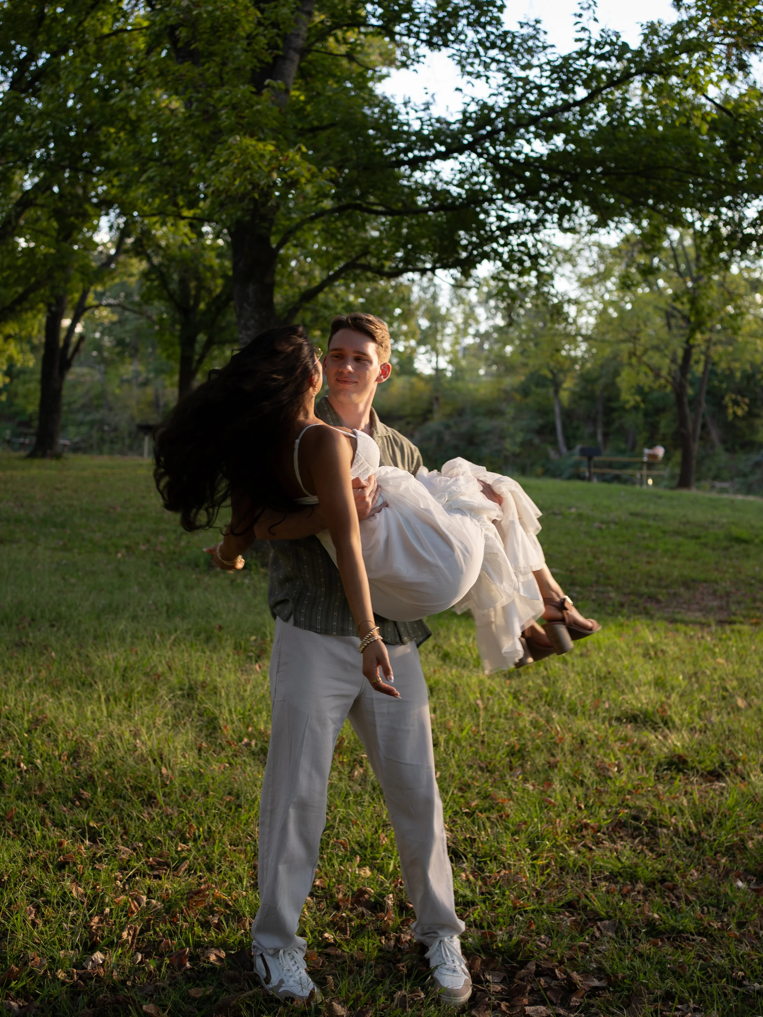 A warm golden-hour portrait in Mammoth Springs, AR, capturing both strength and softness in a natural, open setting.