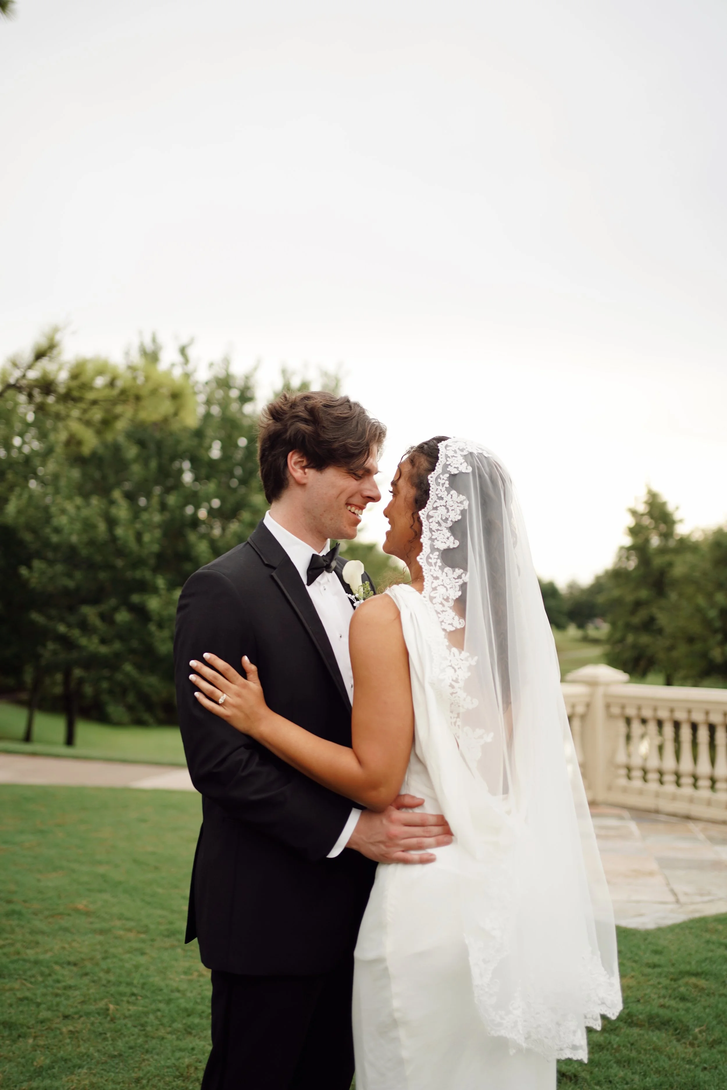 A romantic portrait in Richmond, Texas, capturing the couple in warm light and natural connection.
