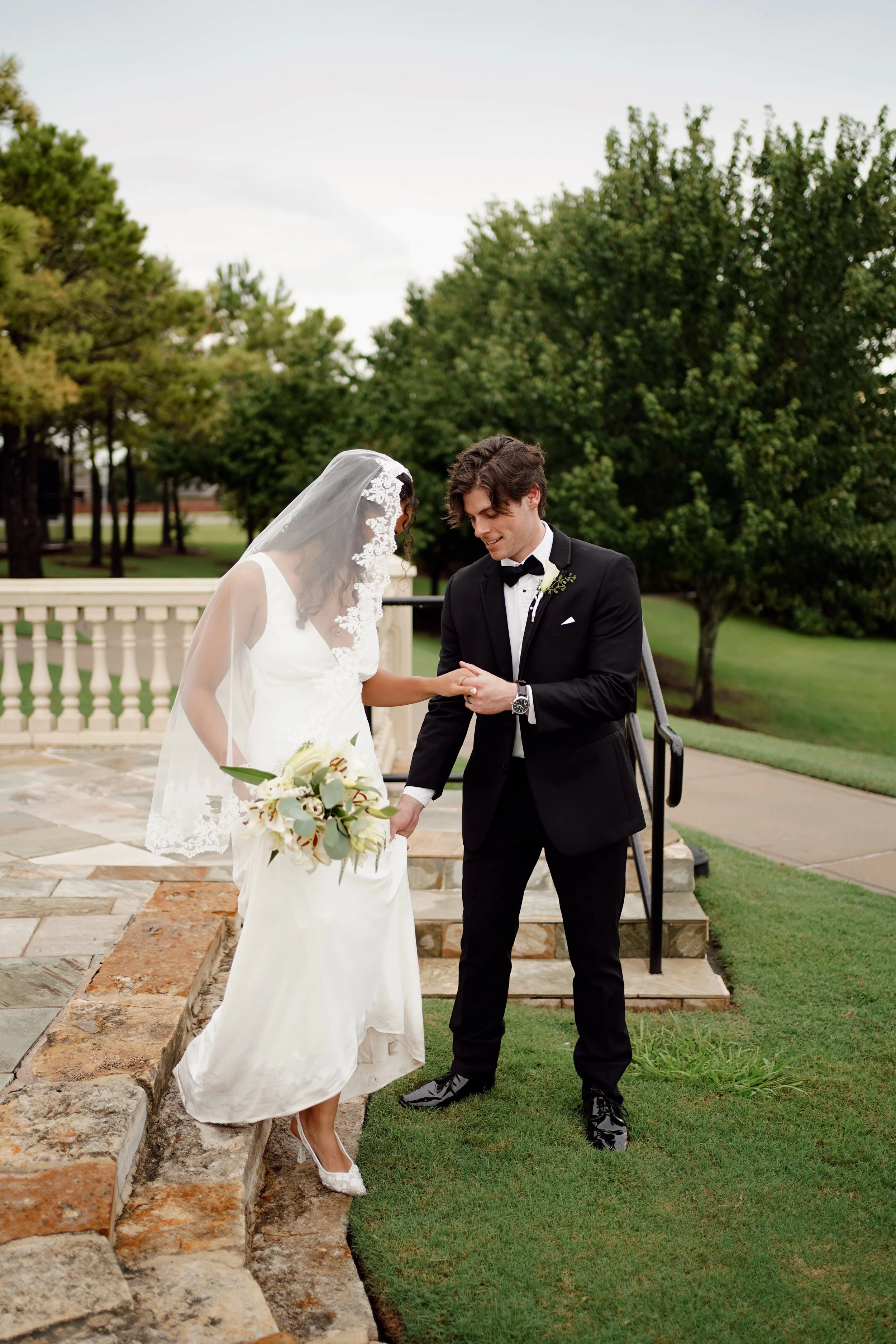 A quiet, intentional moment between the couple in Richmond, Texas, set against a natural outdoor backdrop.