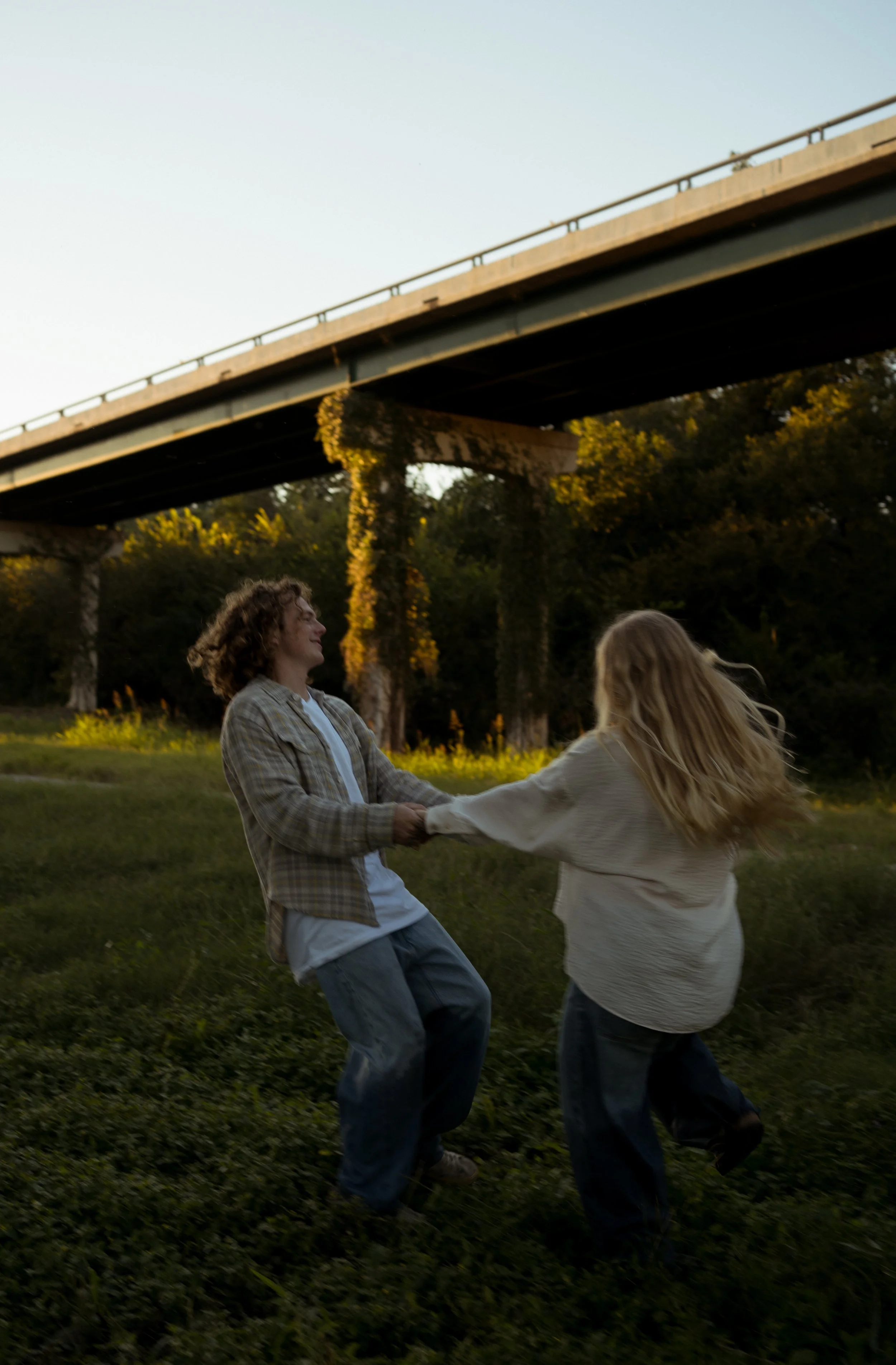 A joyful and playful moment in Rainbow, TX, capturing movement, connection, and the warmth of golden light.