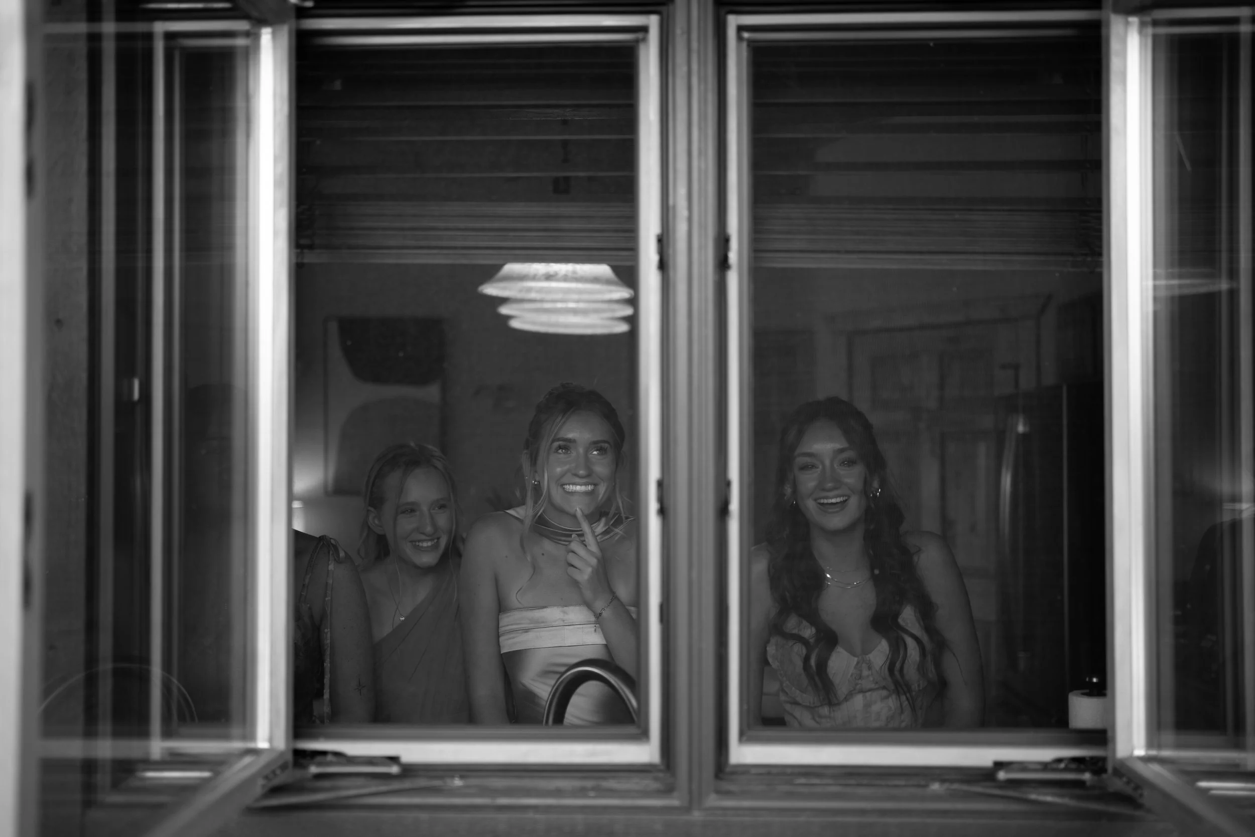 A creative black-and-white composition in Woodland Park, Colorado, capturing layered storytelling through reflection and framing.