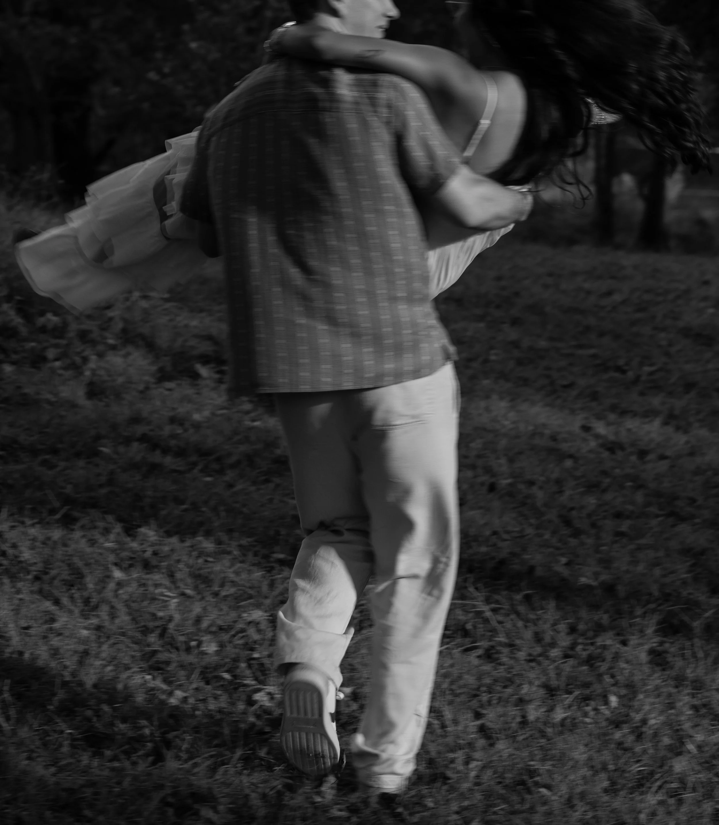 An artistic black-and-white moment in Mammoth Spring, Arkansas, capturing motion and spontaneity.