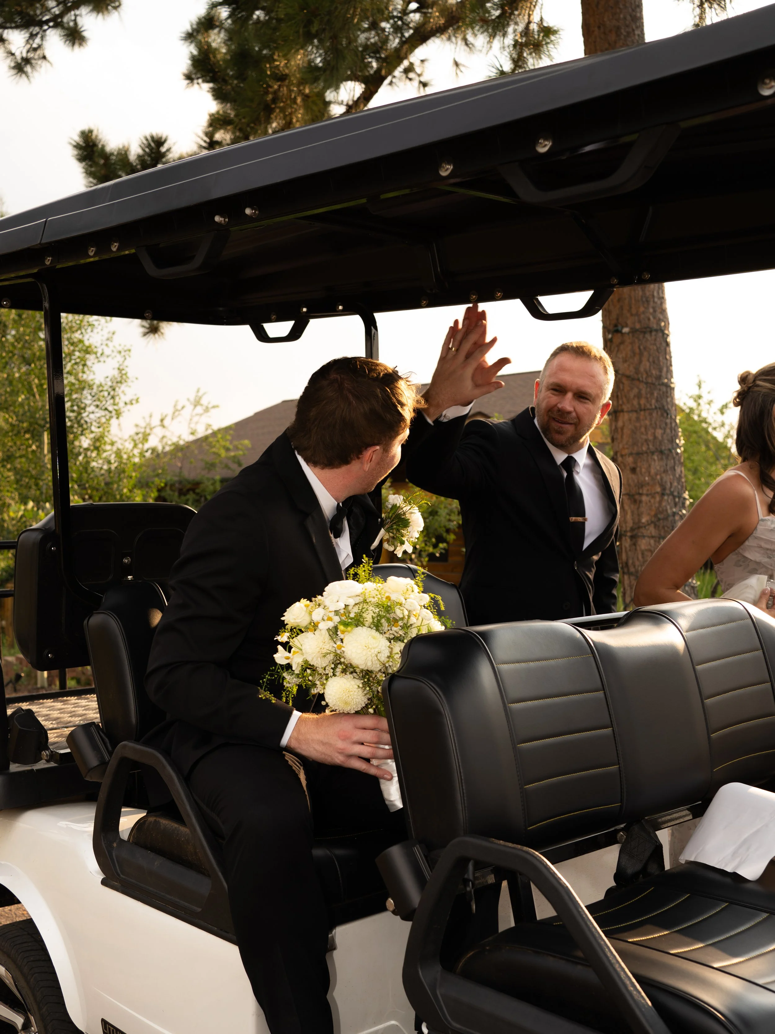 A joyful moment at Pikes Peak Ranch as the couple celebrates with guests, capturing energy and excitement.