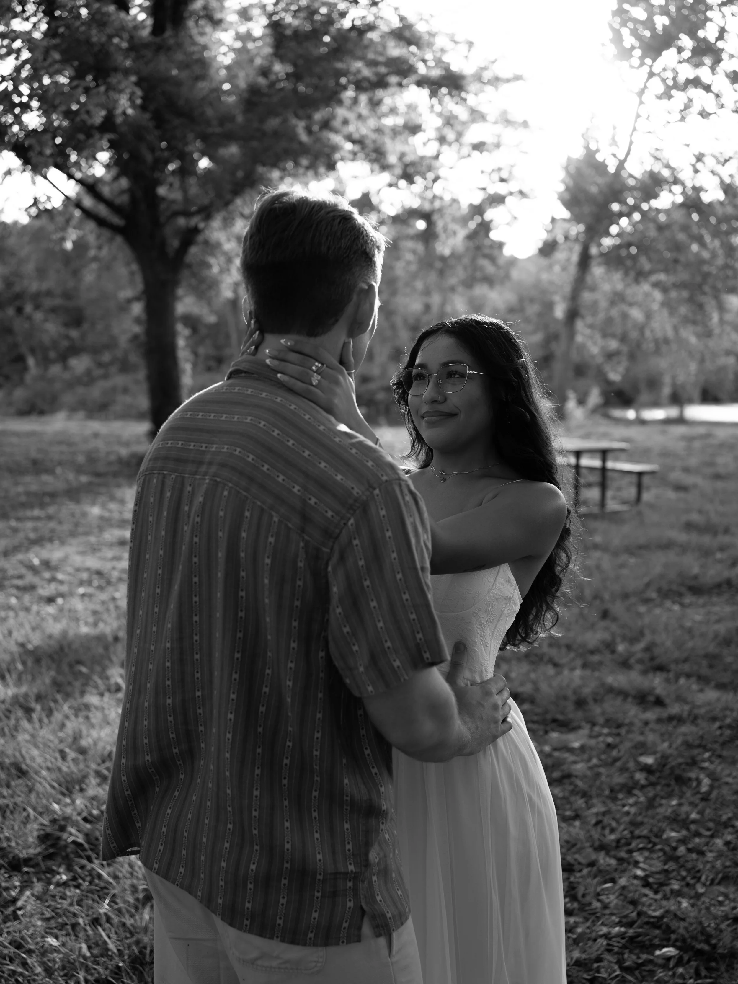 An intimate black-and-white portrait in Mammoth Spring, Arkansas, focusing on connection and quiet emotion.