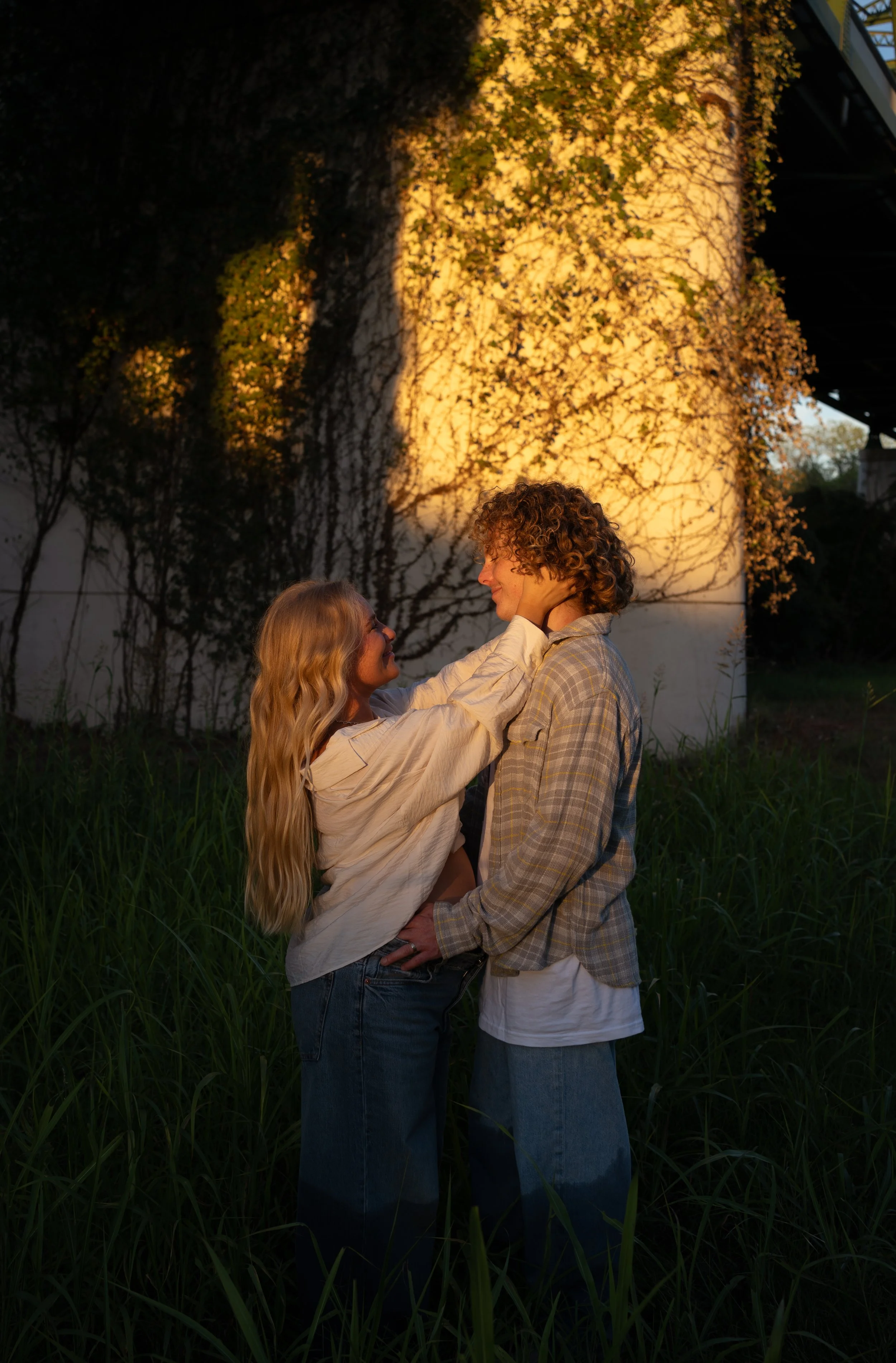 A soft, golden-hour portrait in Rainbow, Texas, capturing connection and quiet intimacy.
