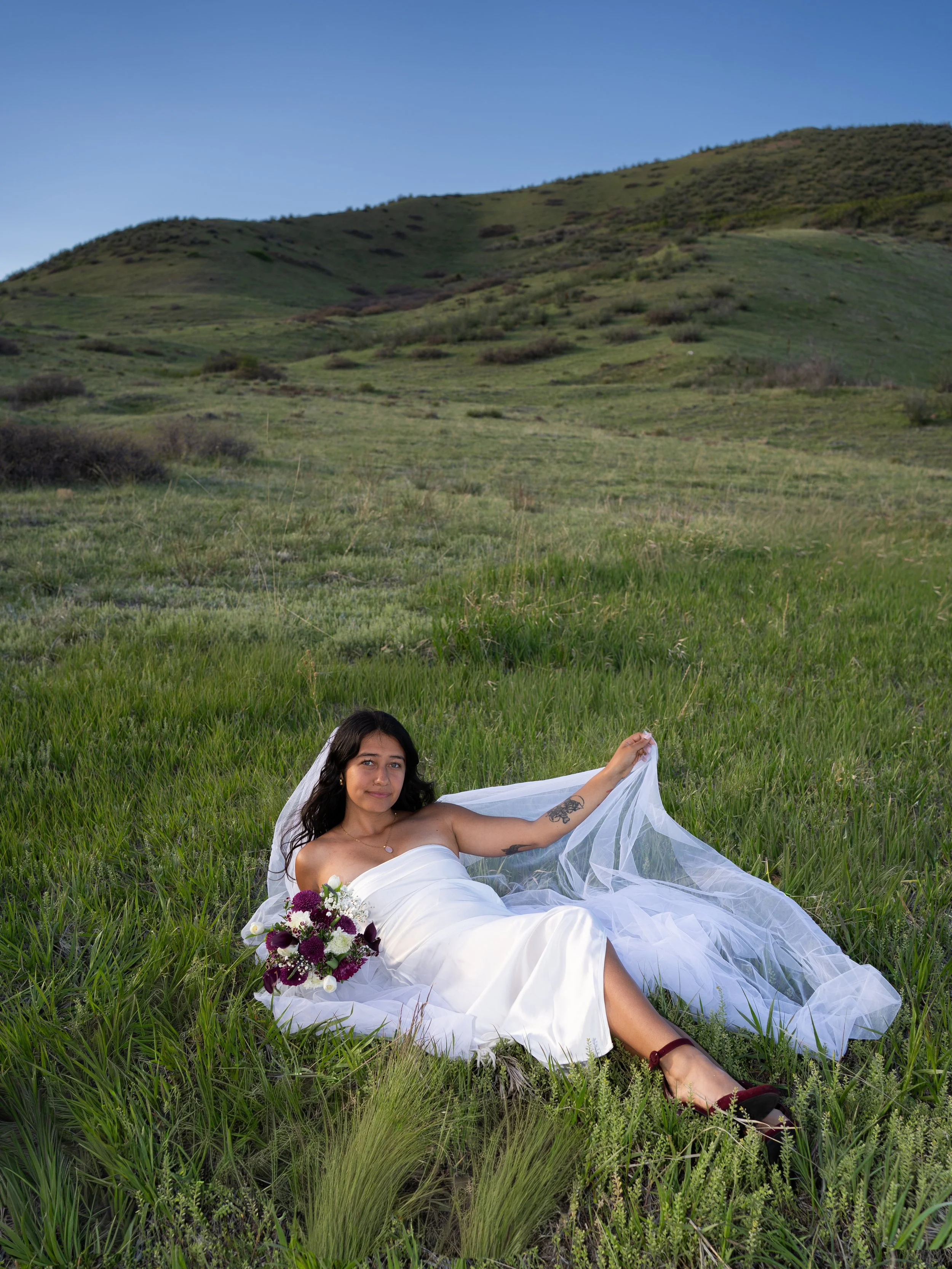 A soft and refined bridal portrait in Boulder, Colorado, framed by natural textures and open light.
