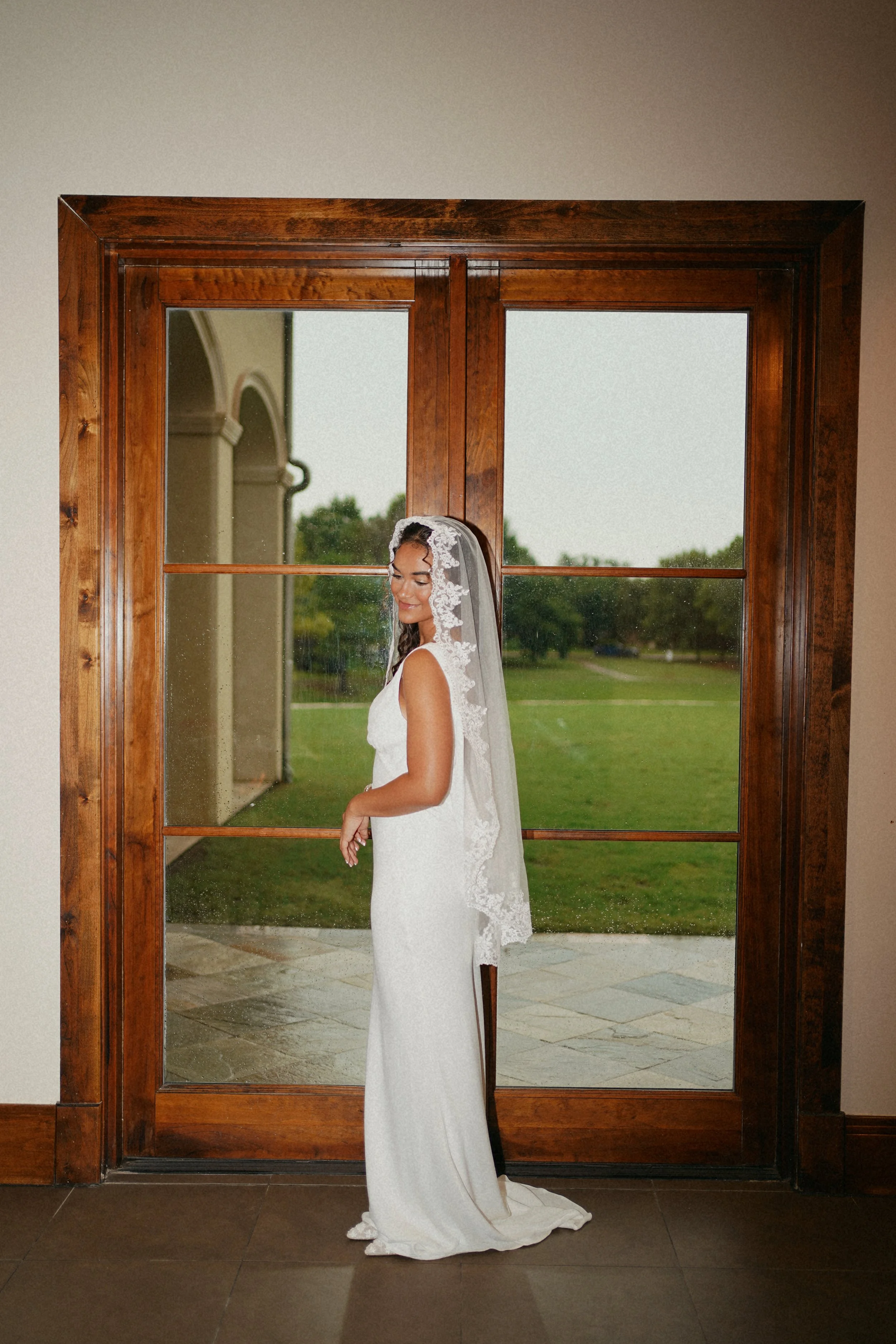 A timeless bridal portrait in Richmond, TX, framed by architectural lines and soft natural light.