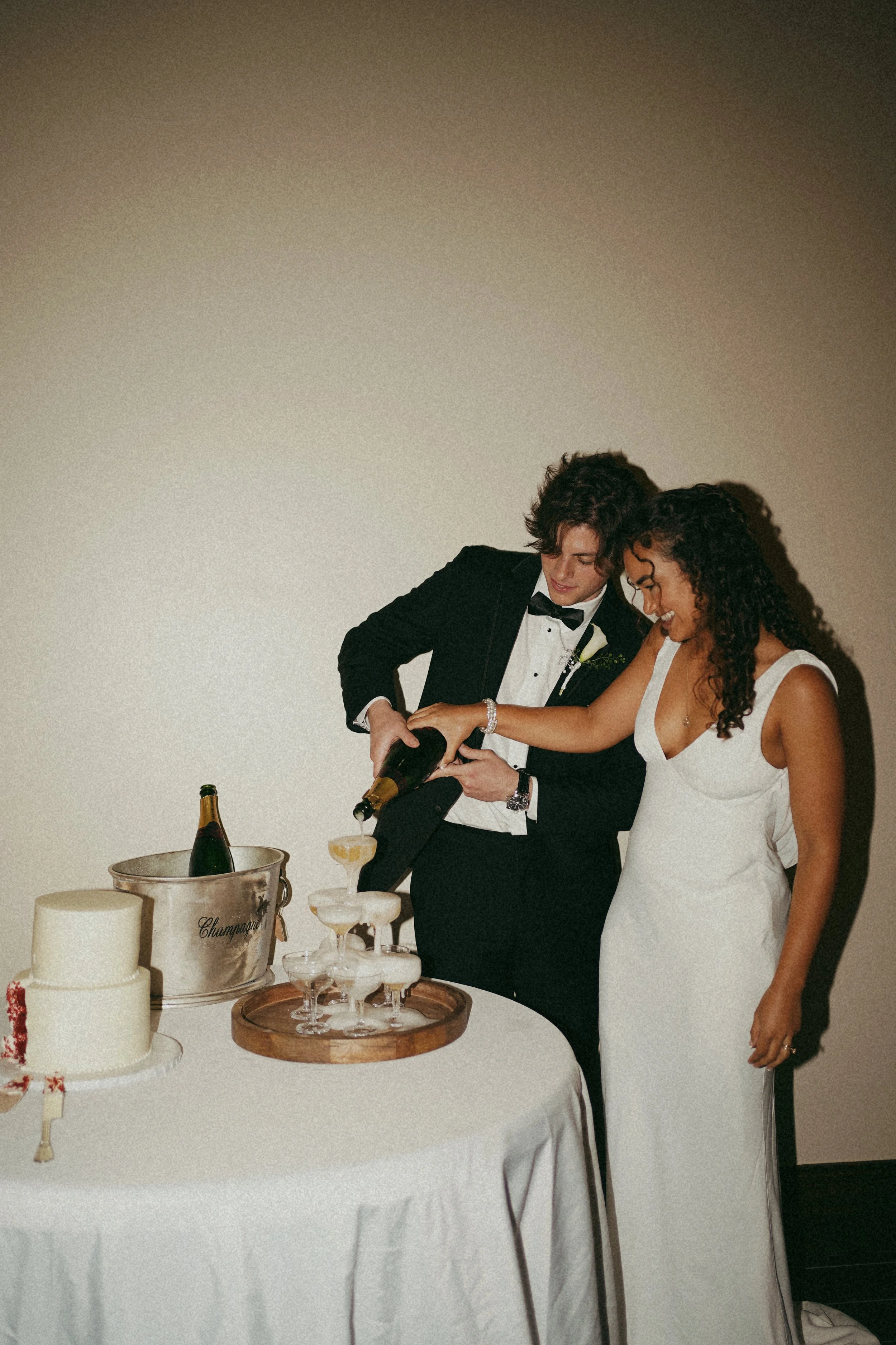 A quiet cake-cutting moment in Richmond, TX, capturing connection and subtle celebration through soft, candid interaction.
