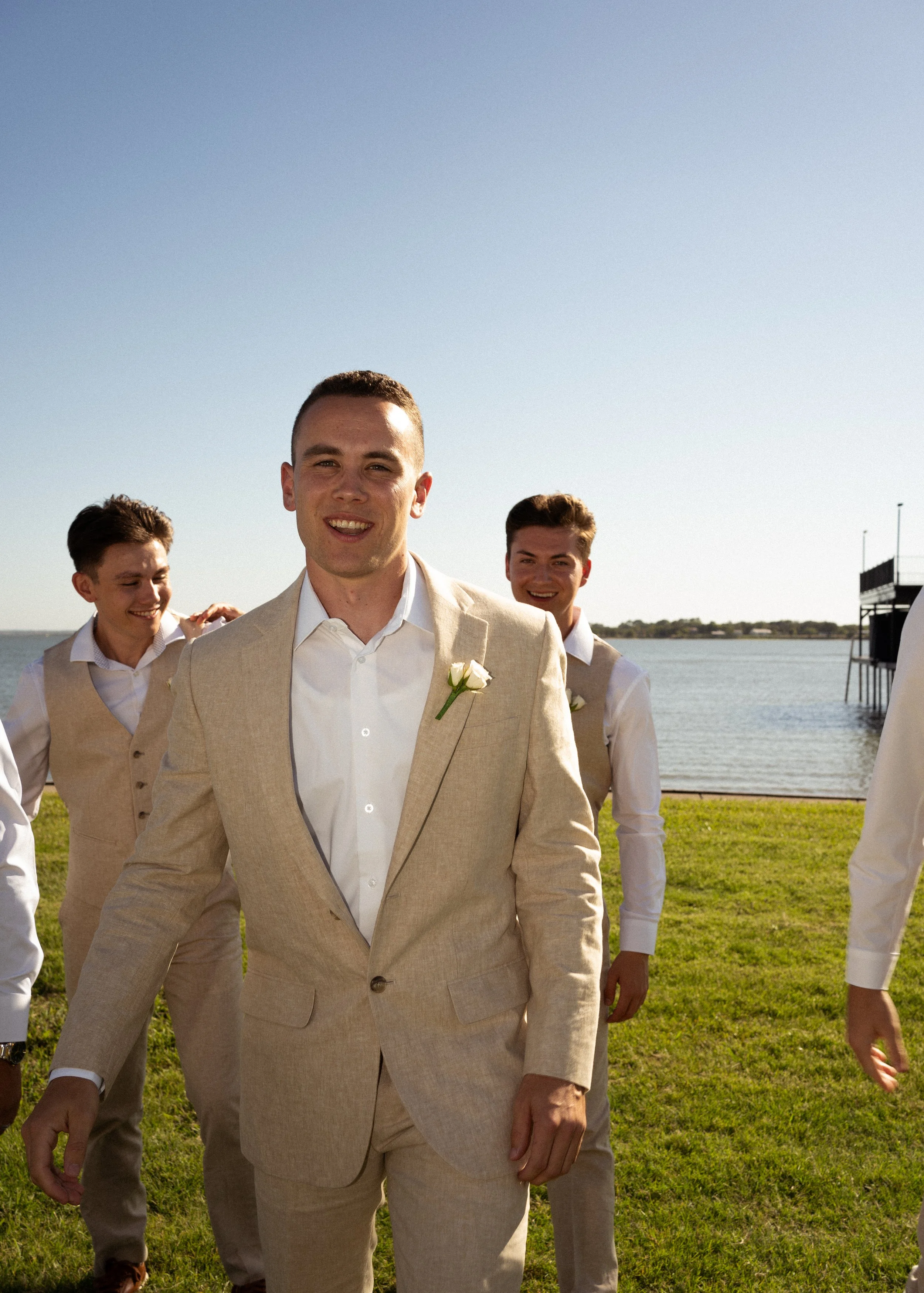 Candid groom portrait captured during a backyard tent wedding in Fort Worth, Texas.