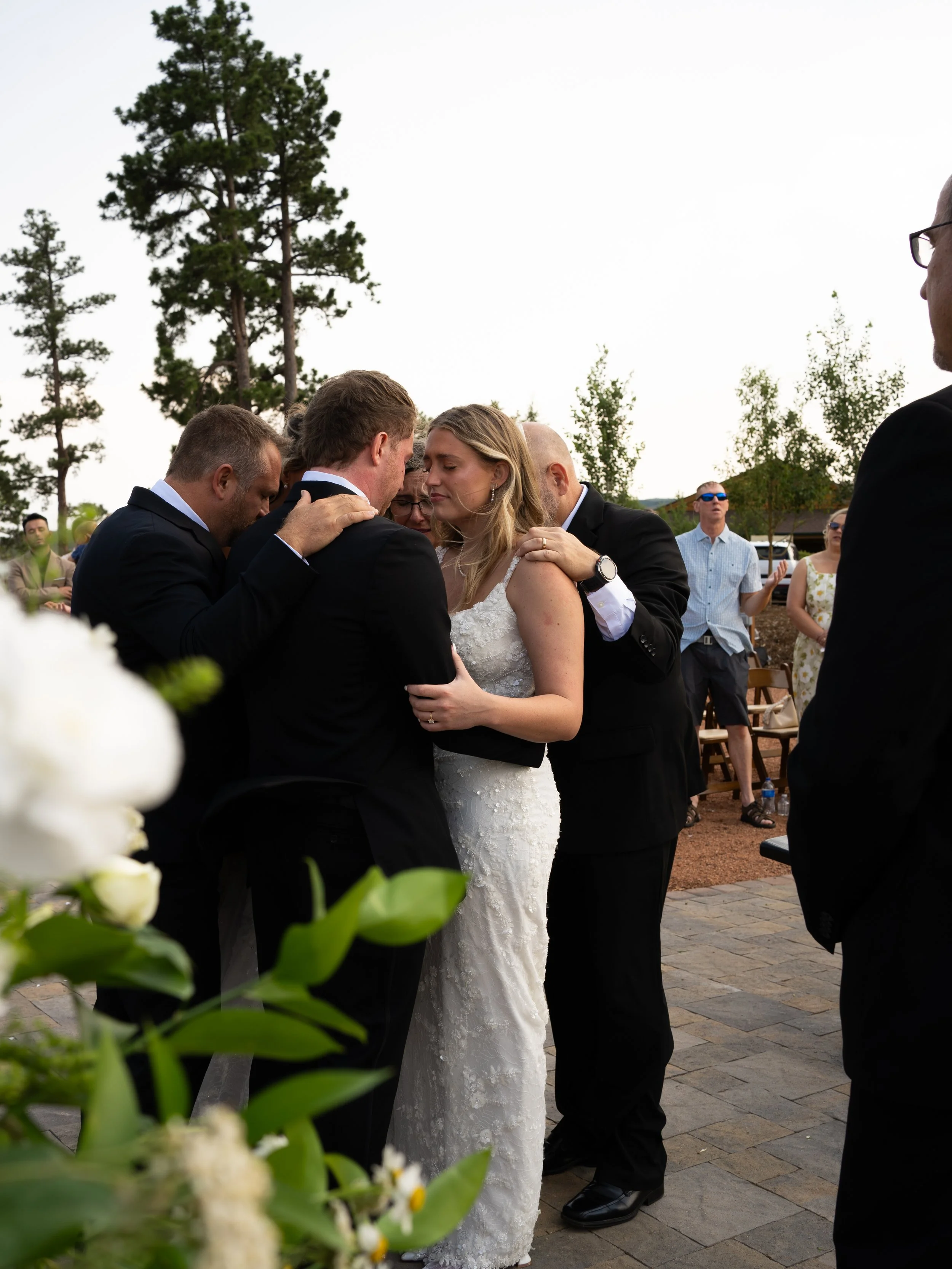 An emotional ceremony moment at Pikes Peak Ranch, capturing connection and heartfelt interaction during the celebration.