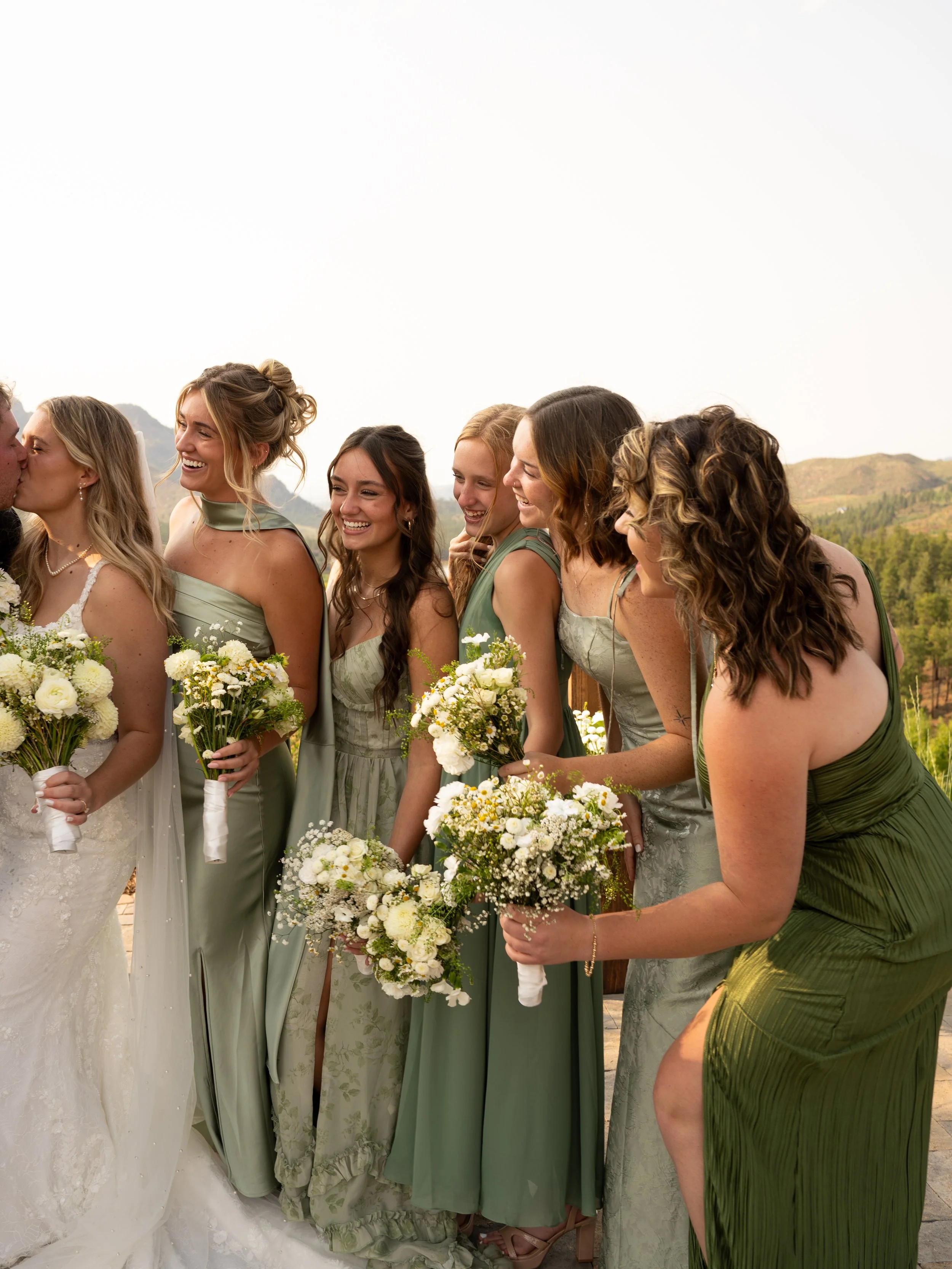 A joyful bridal party moment in Woodland Park, Colorado, capturing connection, movement, and natural light.