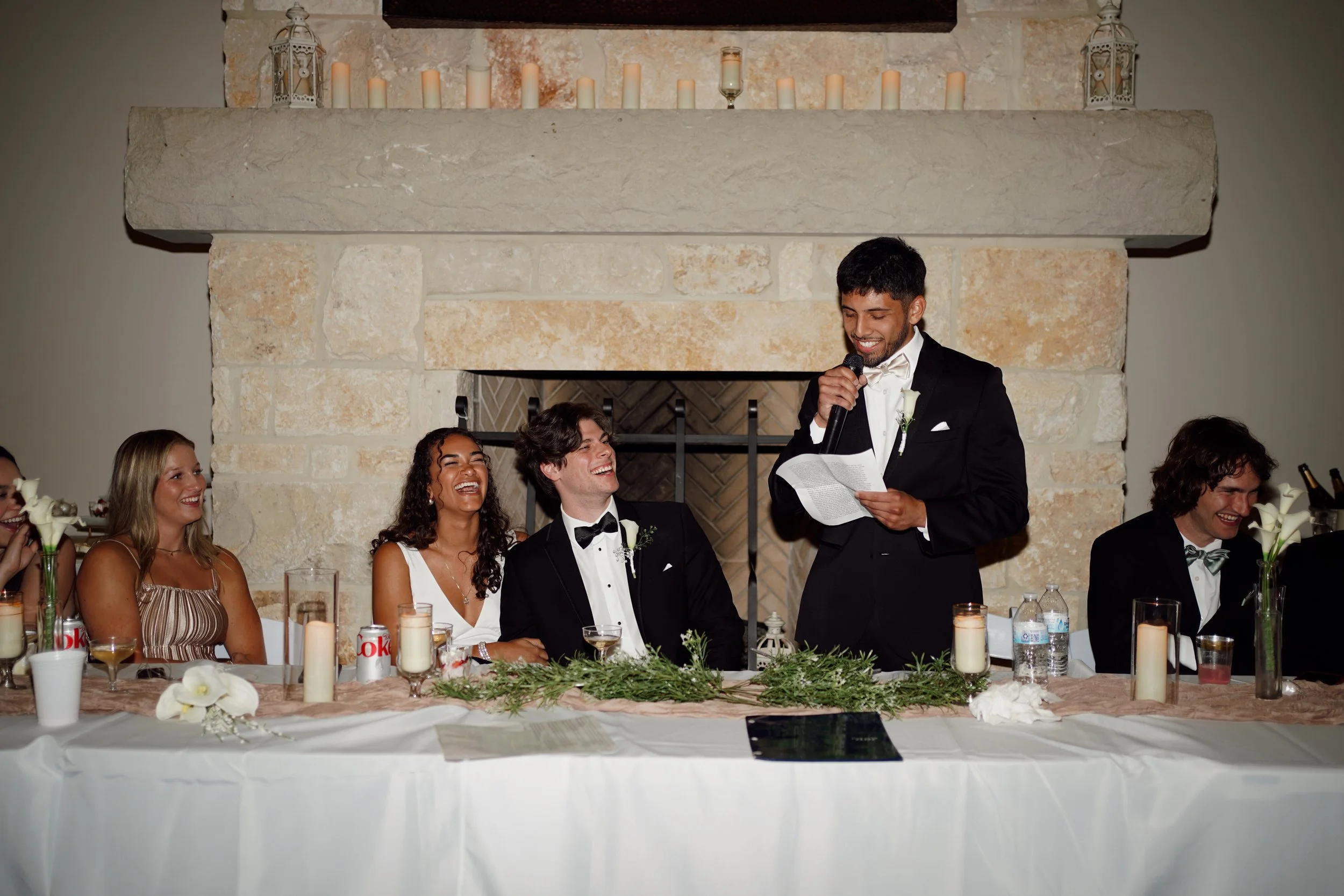 A candid reception toast in Richmond, Texas, capturing laughter, emotion, and connection among the couple and their guests.