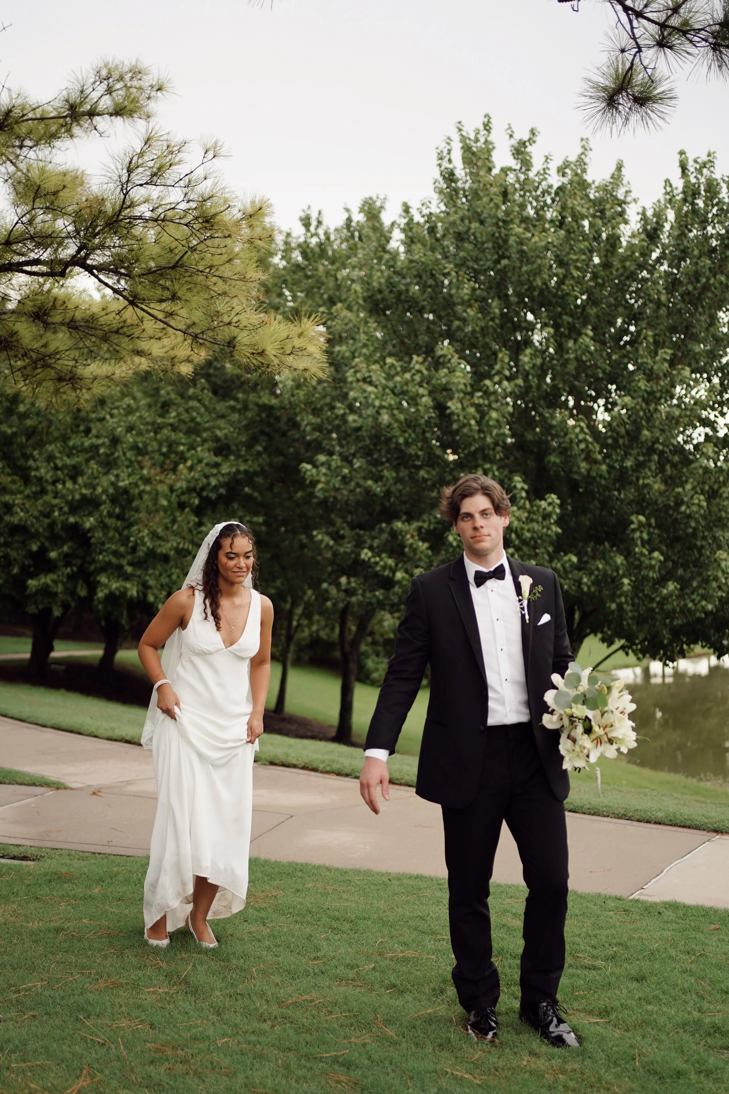A natural post-ceremony moment in Richmond, TX, as the couple walks together, capturing connection and ease.