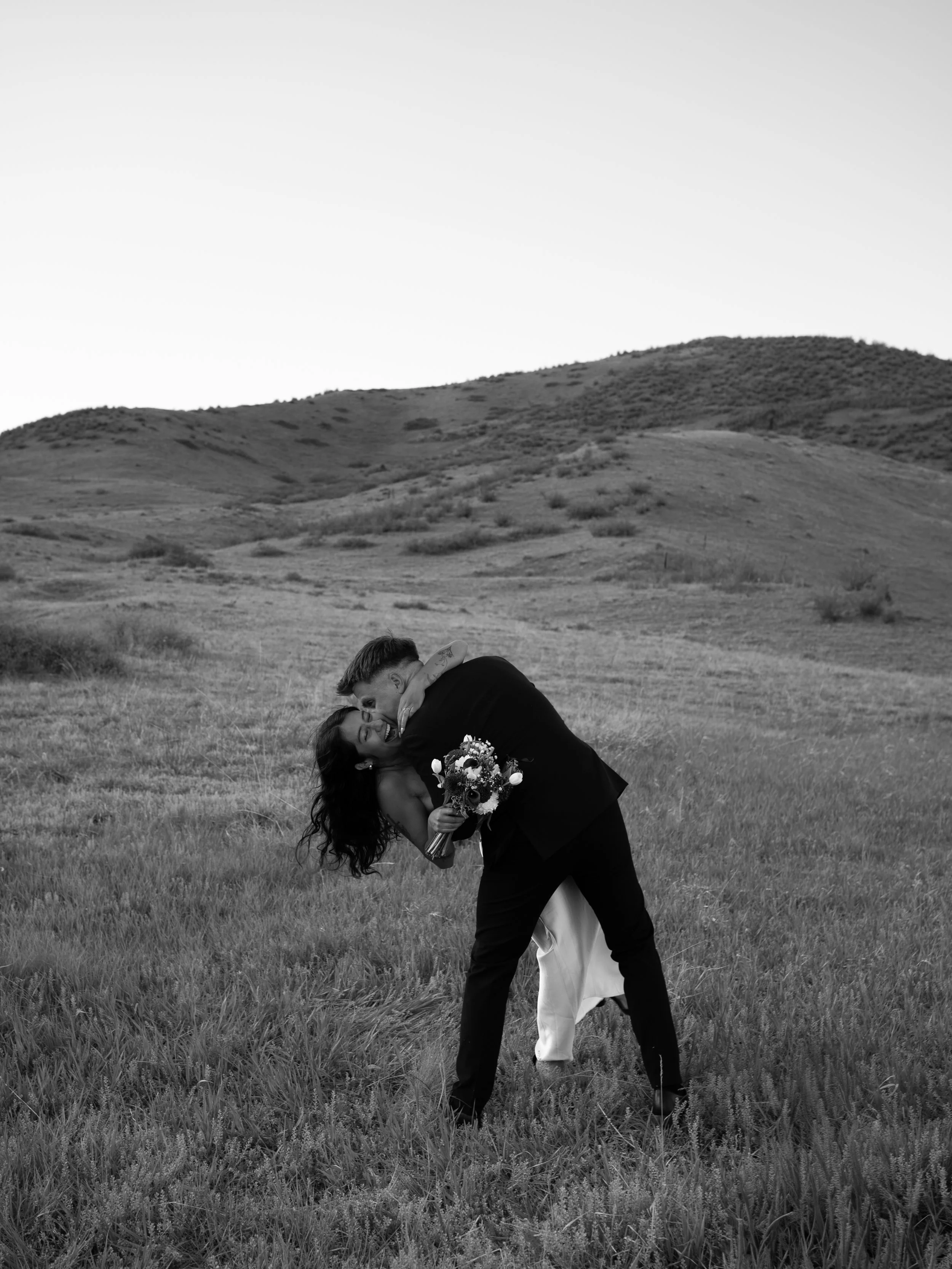 A dynamic black-and-white moment in Boulder, CO, capturing movement and playful connection.