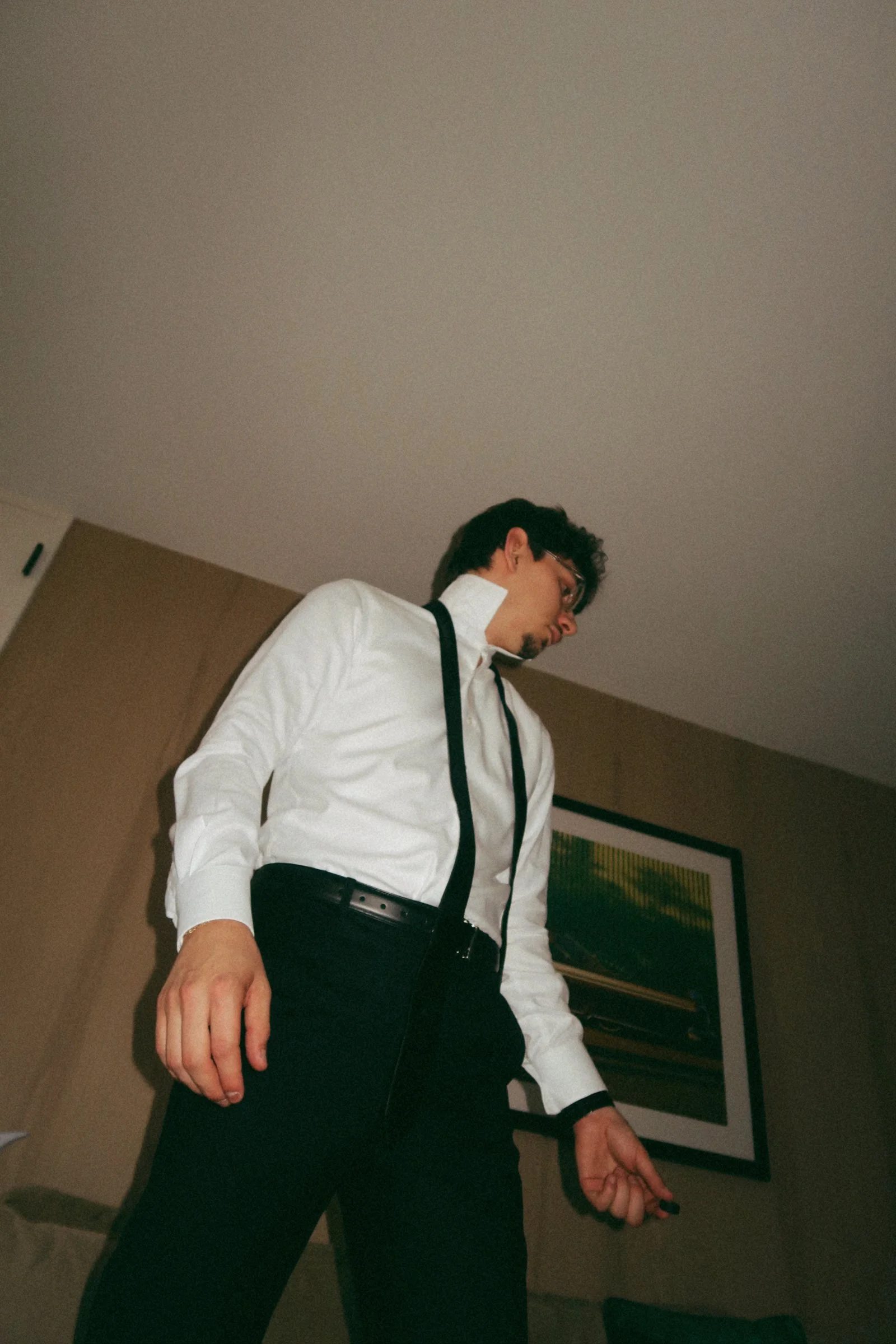 An editorial-style portrait of the groom in Houston, TX, capturing a modern and fashion-forward perspective.