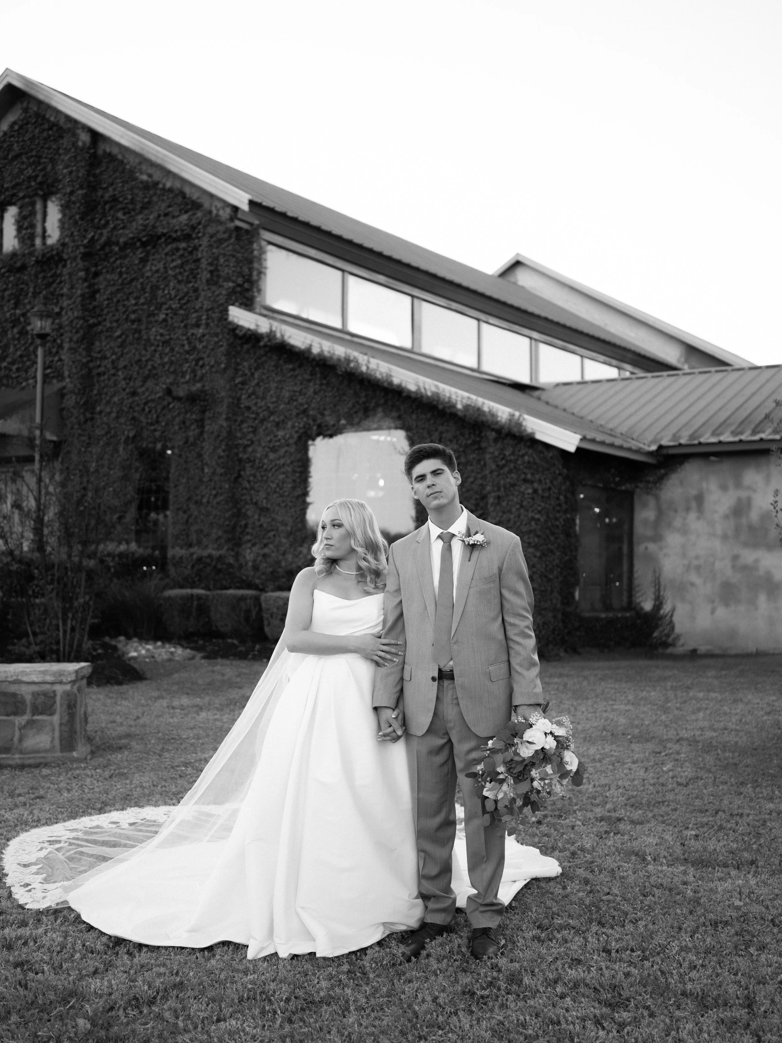 A timeless black-and-white wedding portrait of the bride and groom in Montgomery, TX, blending classic composition with quiet elegance.