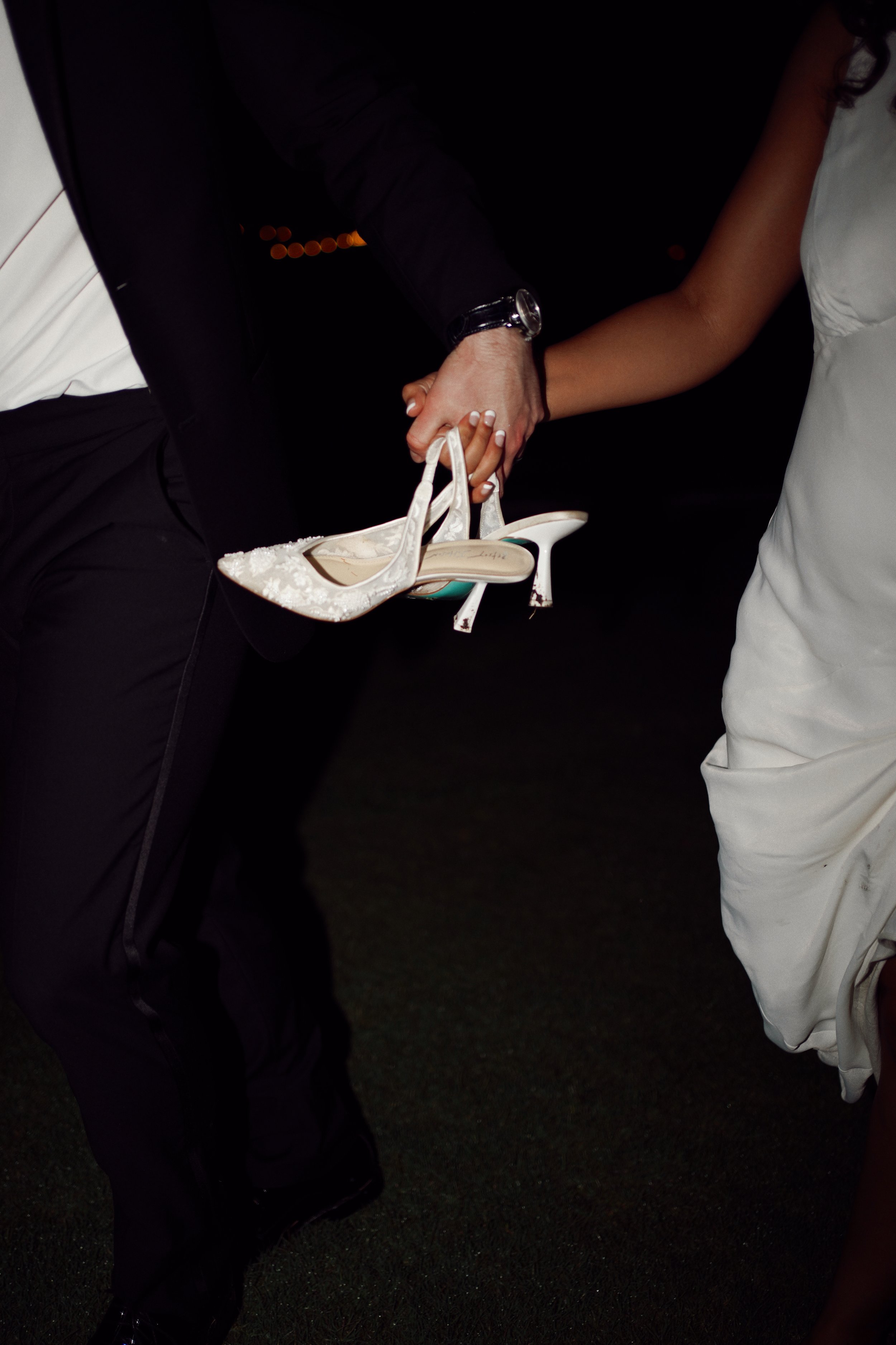A playful wedding detail in Richmond, TX, capturing movement and personality through an unposed moment.