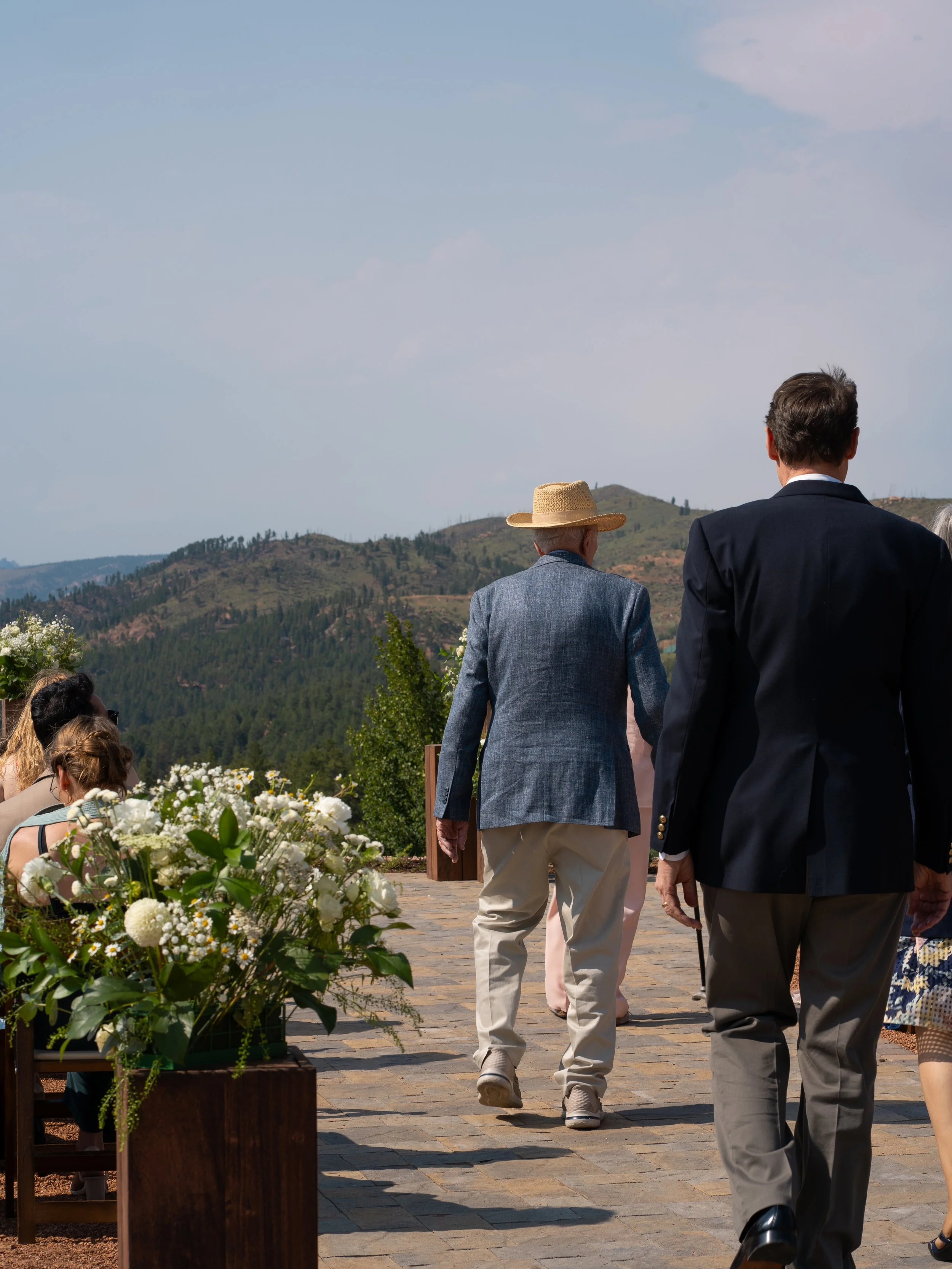 A documentary-style moment in Woodland Park, Colorado, capturing guests as they transition from ceremony to celebration.