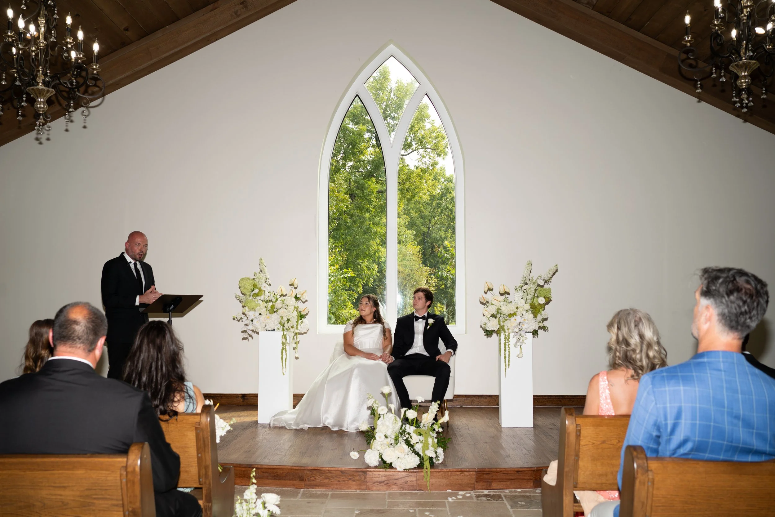 A timeless ceremony scene in Waxahachie, Texas, framed by high ceilings, natural light, and elegant architecture.