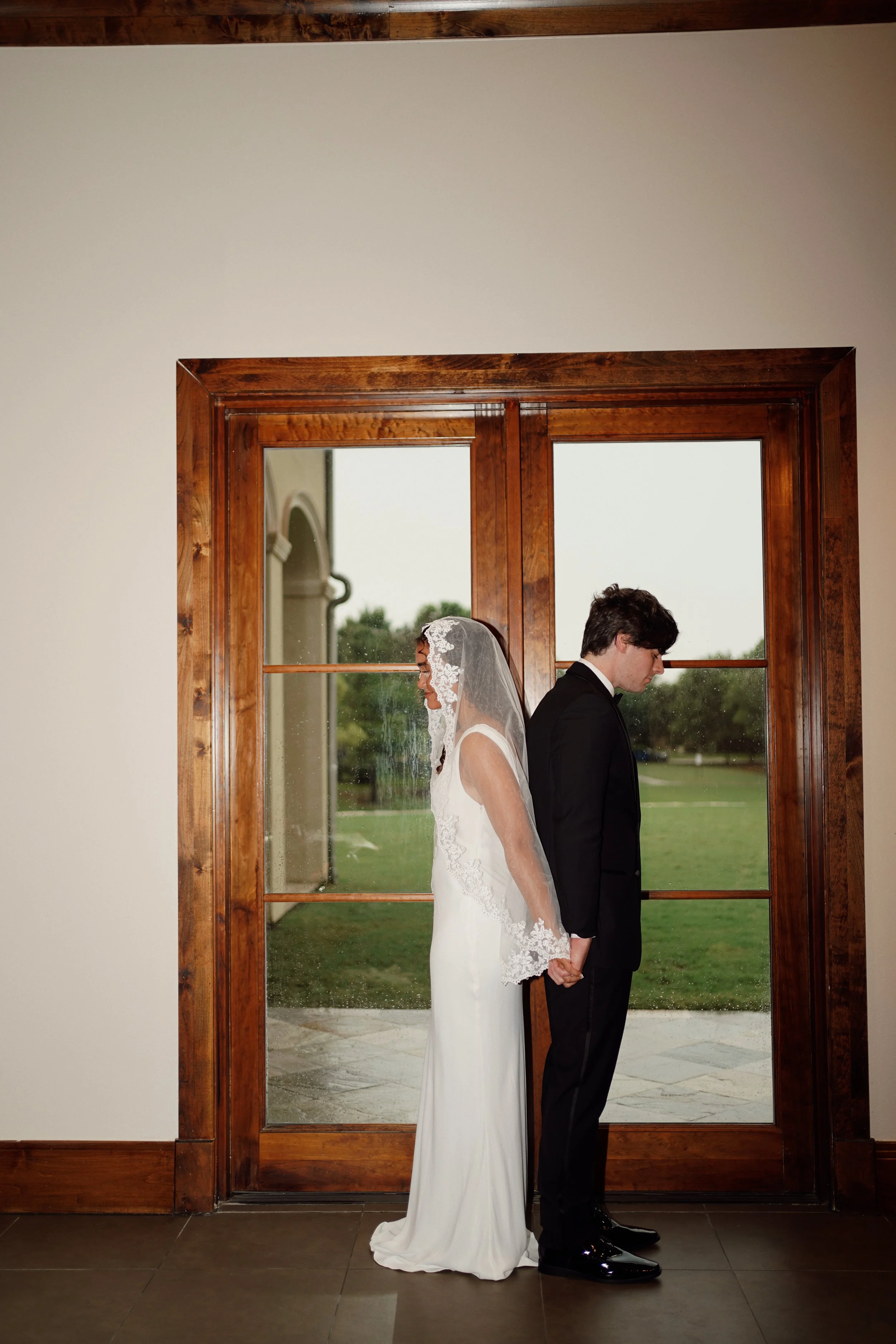 A refined and editorial couple’s portrait in Richmond, Texas, framed by architectural lines and soft light.