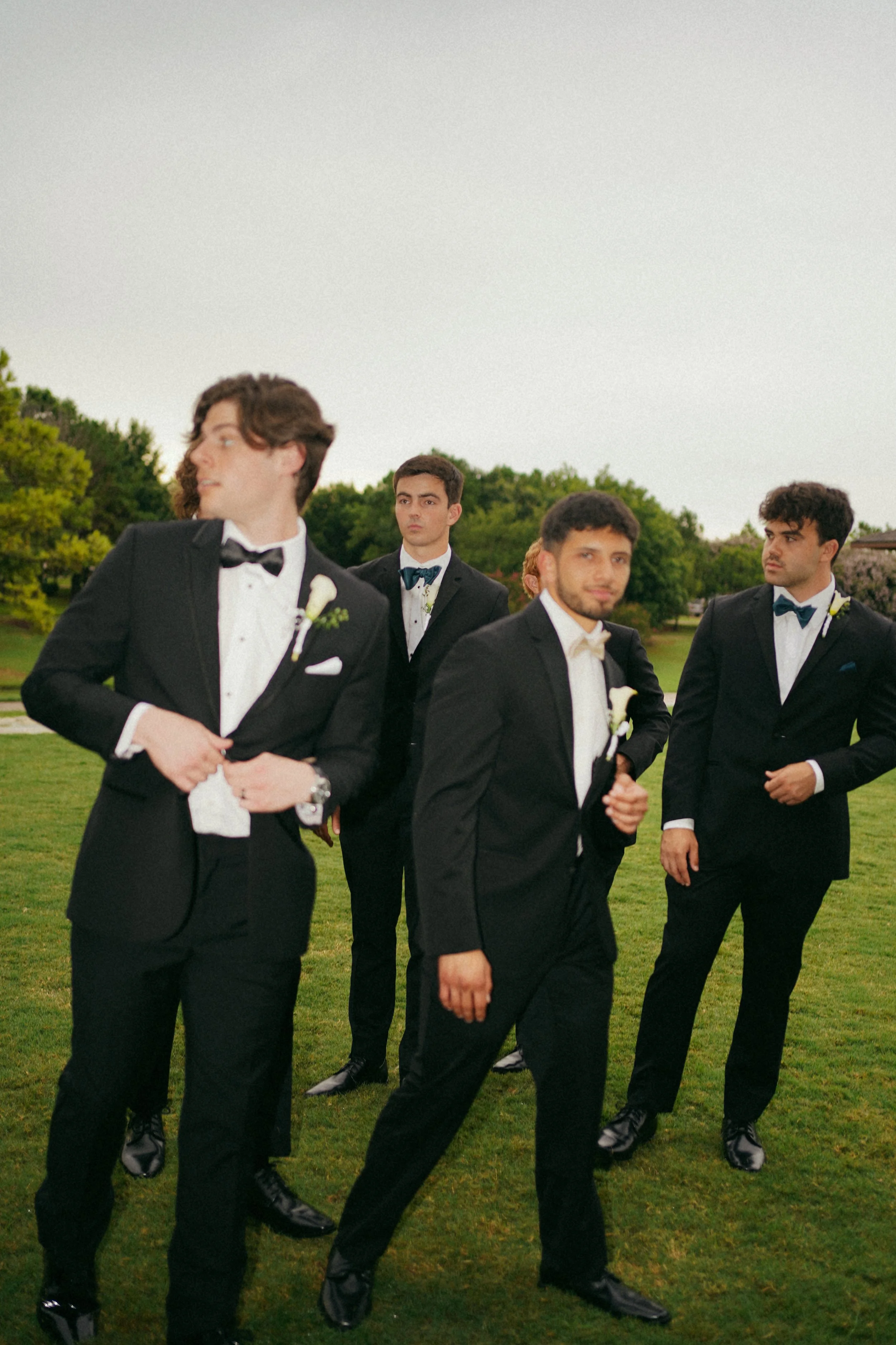 A relaxed and candid groomsmen portrait in Richmond, TX, highlighting personality and natural interaction.