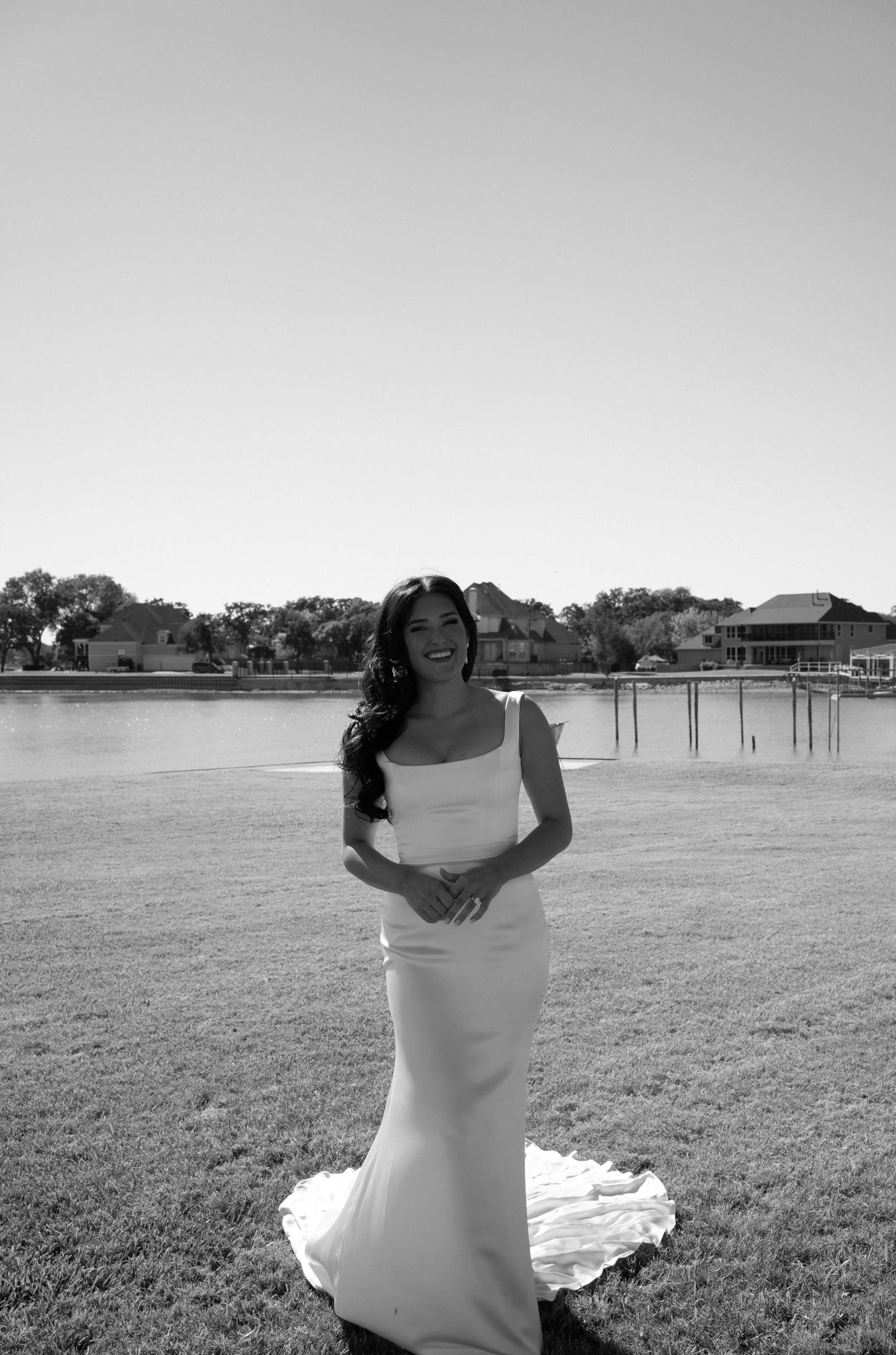Romantic bride portrait by the water during sunset at a backyard wedding in Fort Worth, Texas.