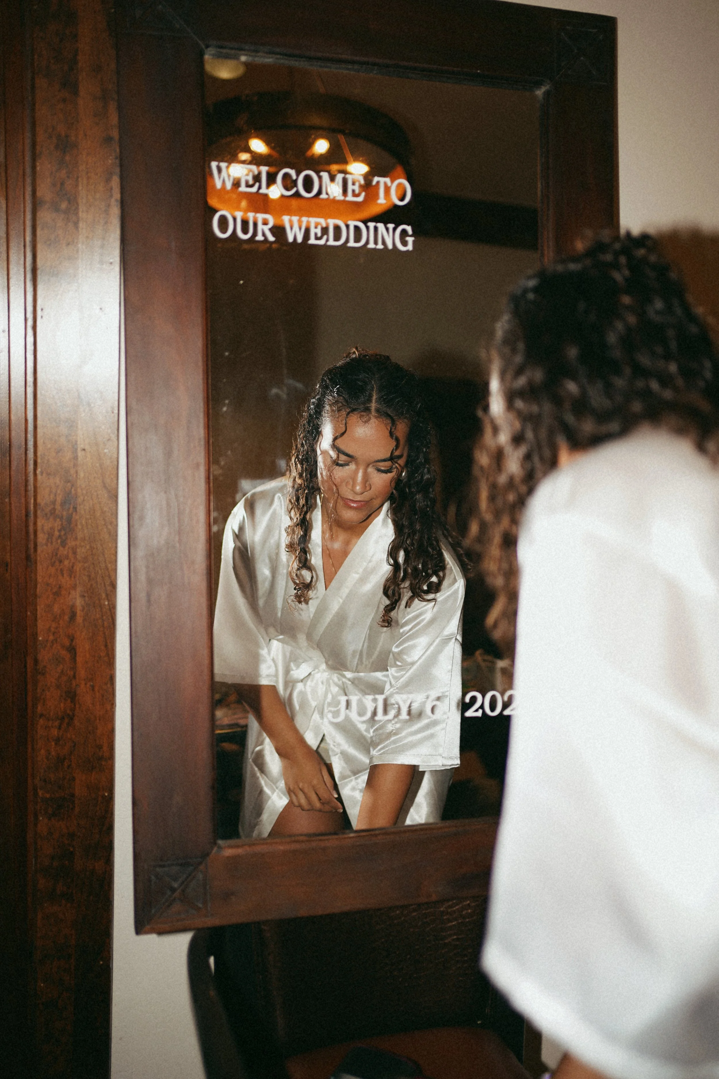 An intimate reflection of the bride in Richmond, TX, capturing a quiet moment through layered composition.