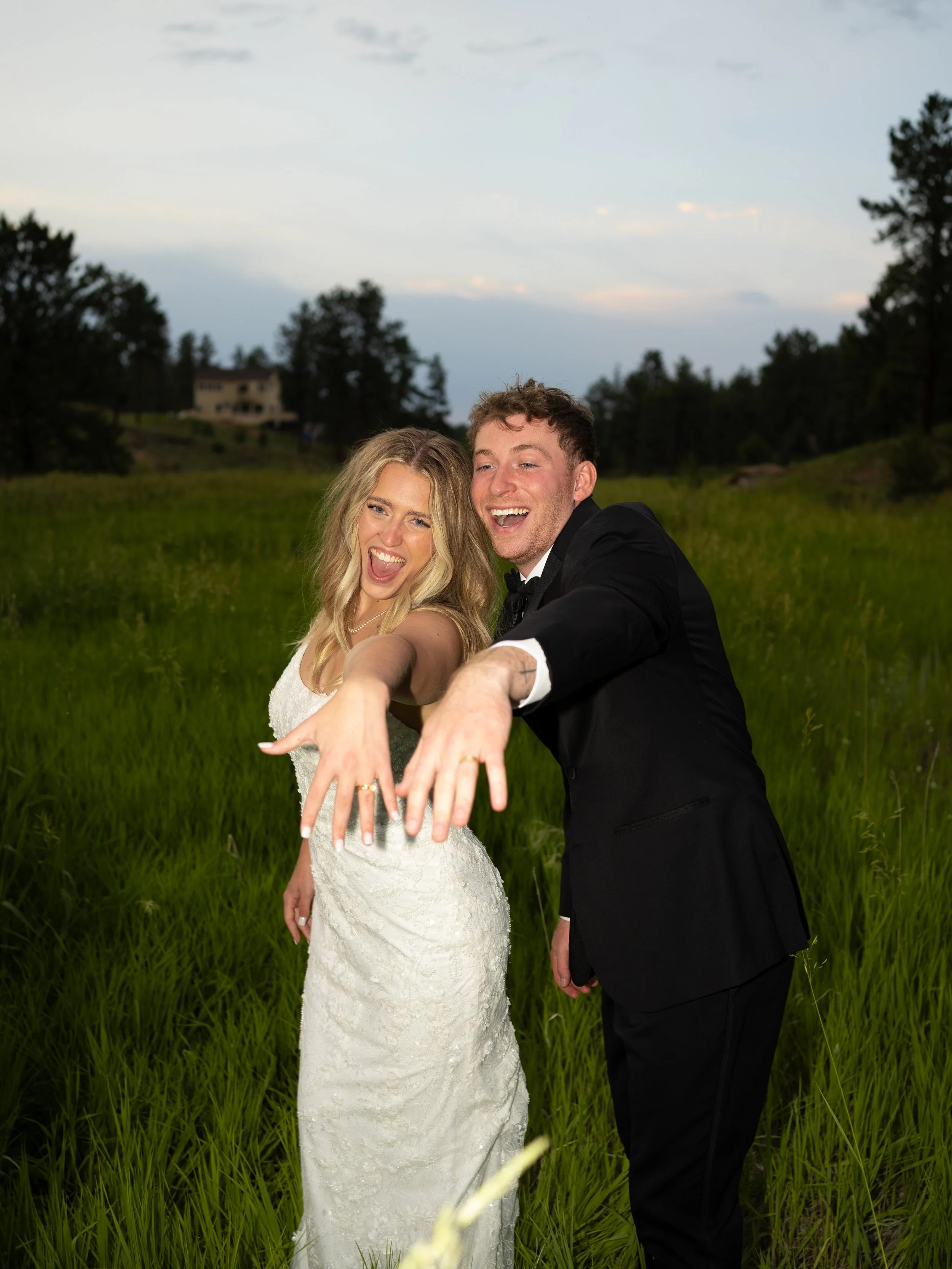 A joyful and playful portrait at Pikes Peak Ranch, capturing personality and excitement just after the ceremony.
