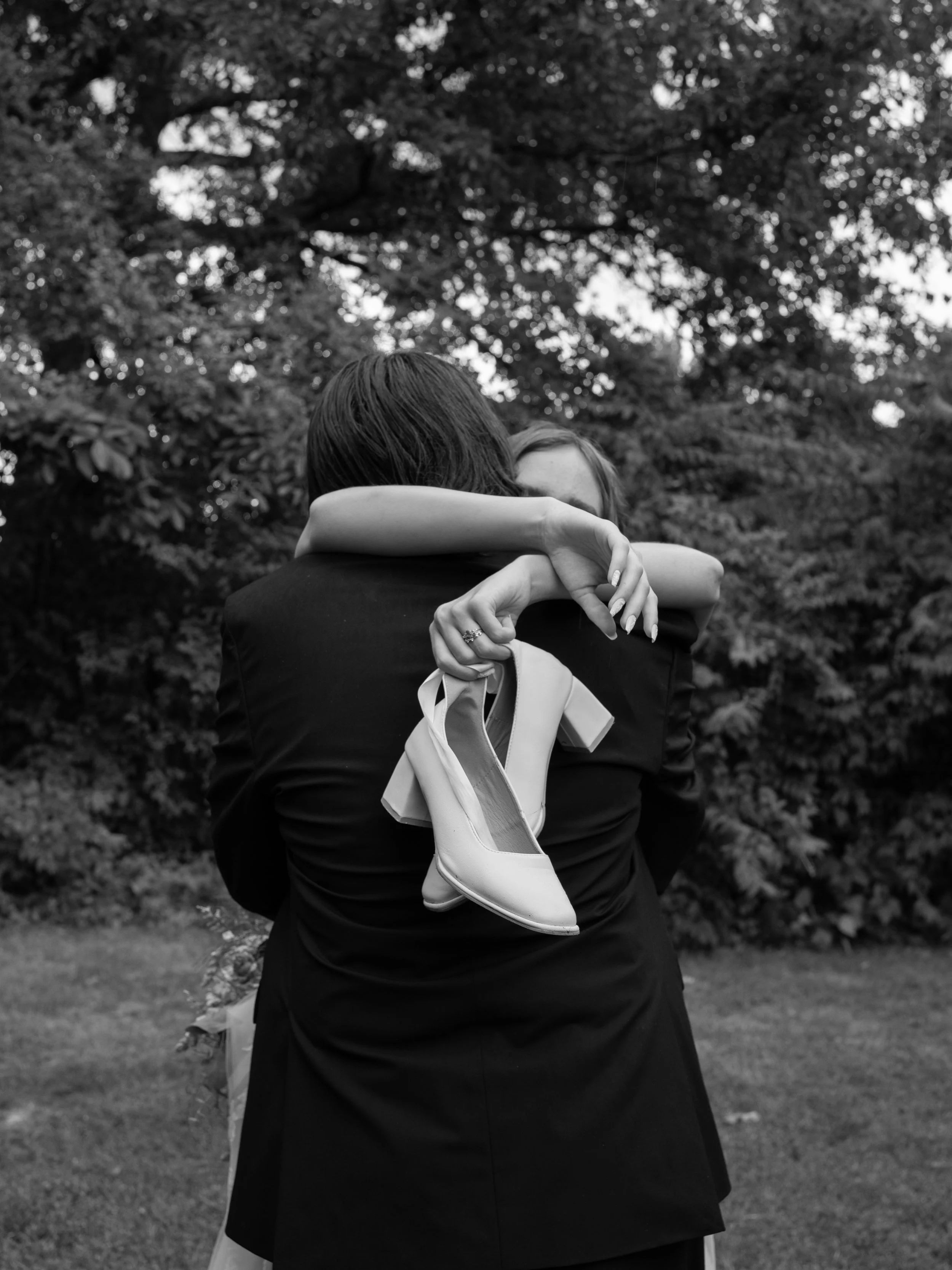 A heartfelt black-and-white moment in O’Fallon, MO, capturing connection and celebration between loved ones.