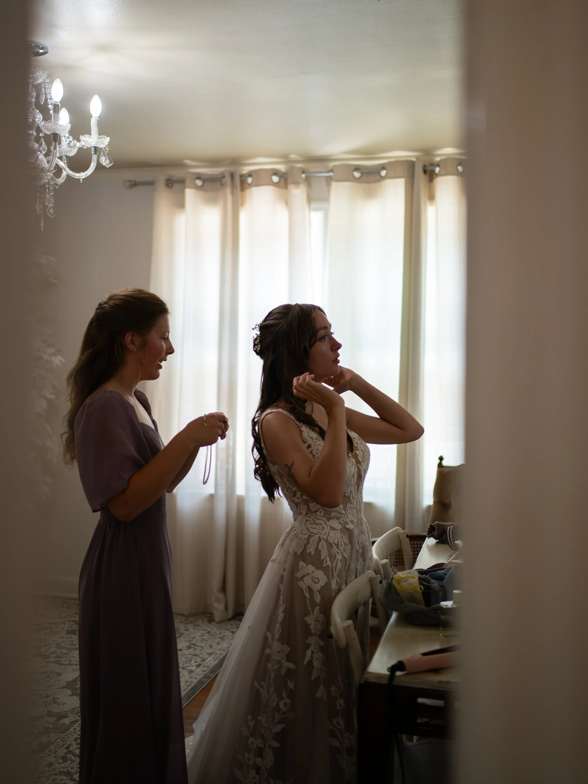 A quiet getting-ready moment in O’Fallon, Missouri, as the bride prepares in soft natural light.