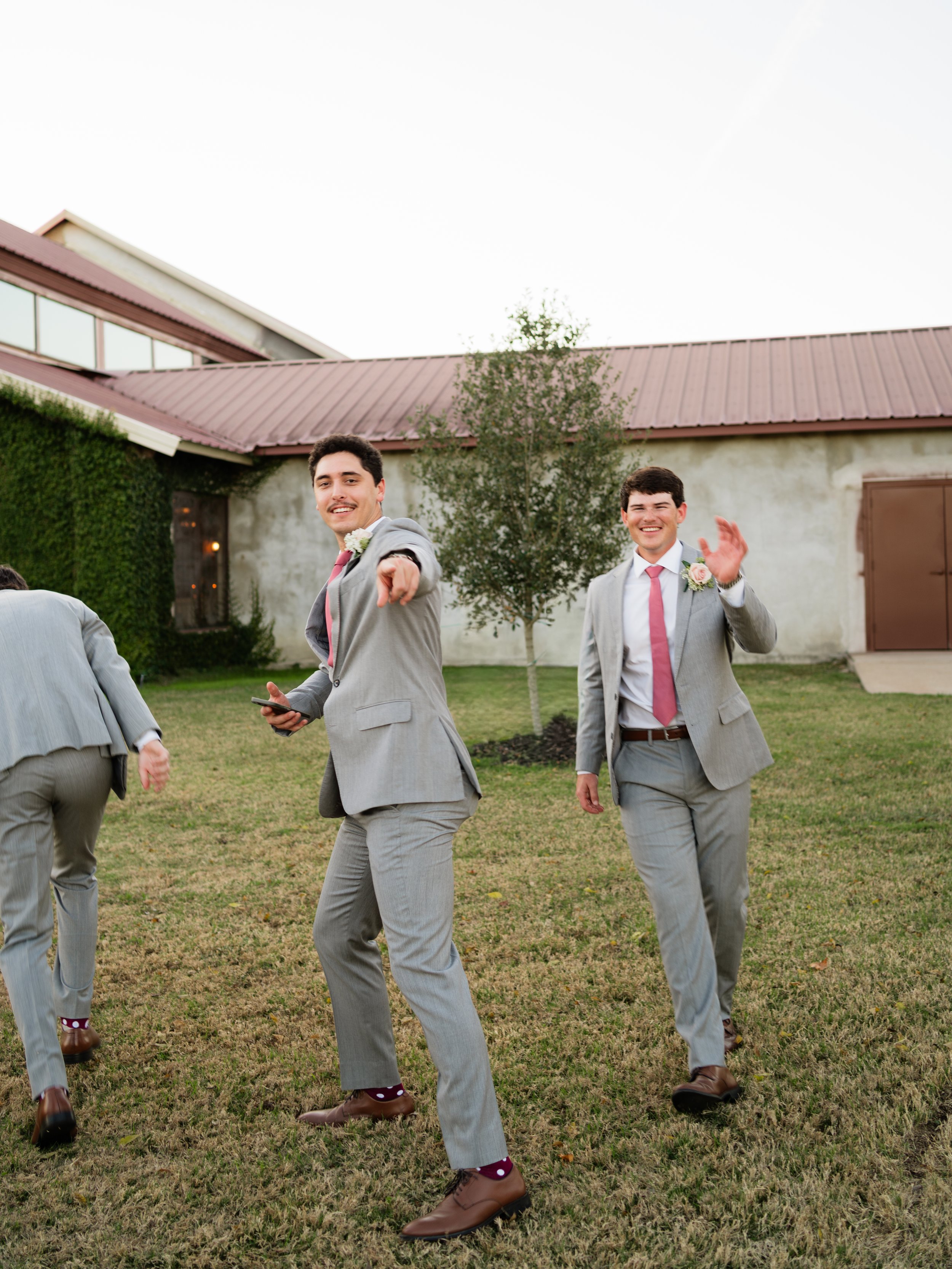 A playfully candid moment with the groom and groomsmen in Montgomery, Texas, capturing personality and lighthearted energy before the ceremony.