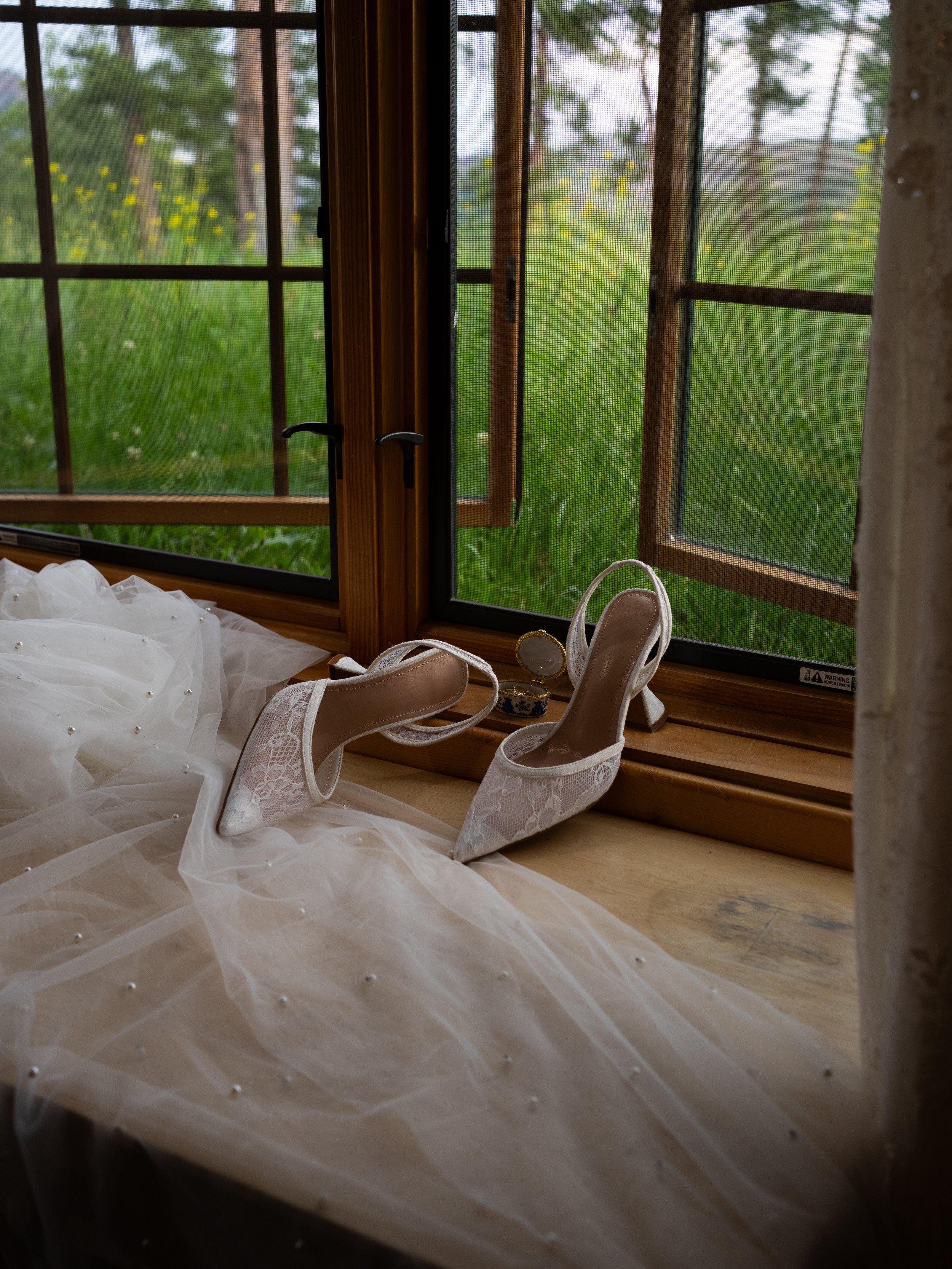 A refined bridal detail at Pikes Peak Ranch, highlighting texture, light, and quiet preparation.