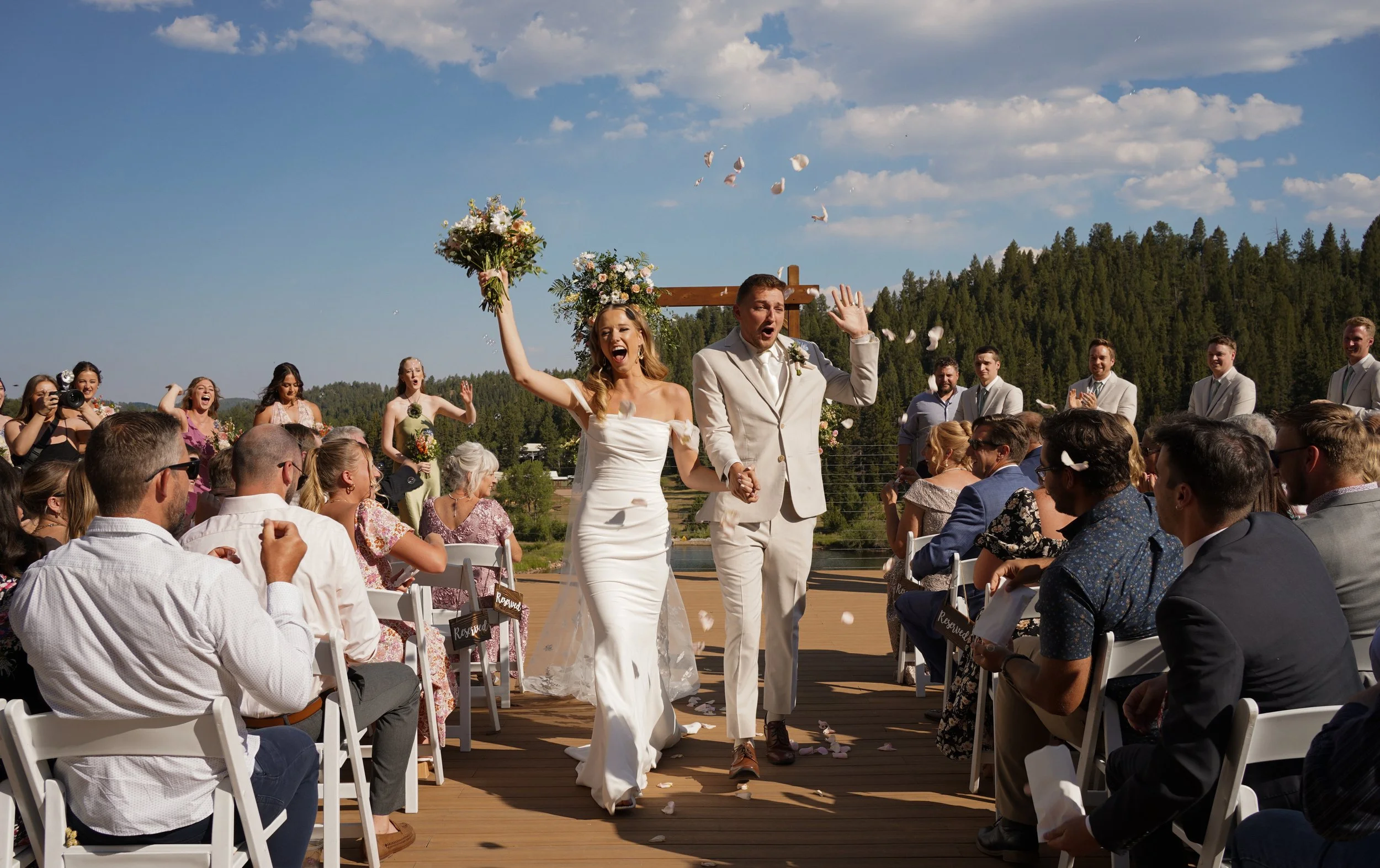Bride and groom celebrating after kiss at the wedding ceremony in Pine, Colorado