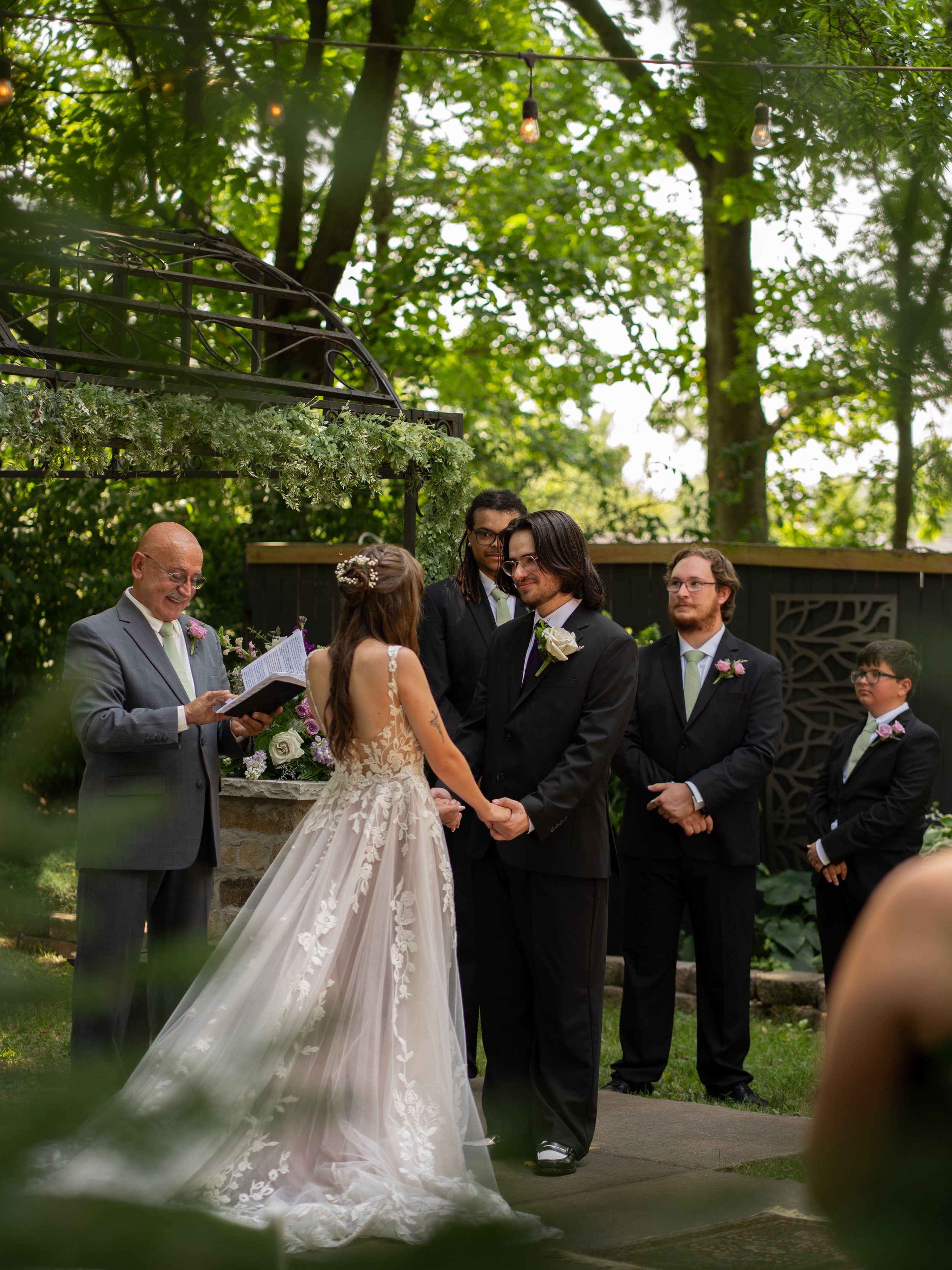 A meaningful ceremony moment in O’Fallon, MO, capturing the exchange of vows in a quiet, intimate setting.