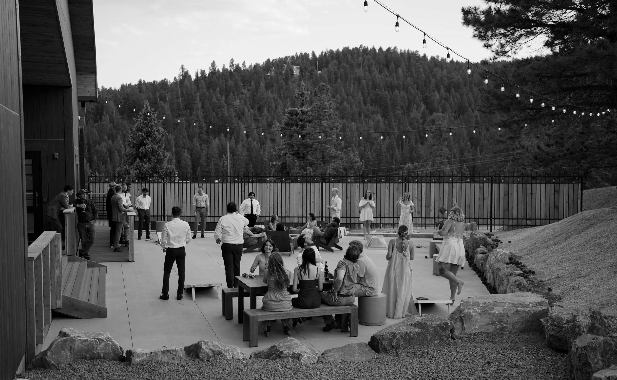 Candid landscape shot with guests at wedding in Pine, Colorado during cocktail hour