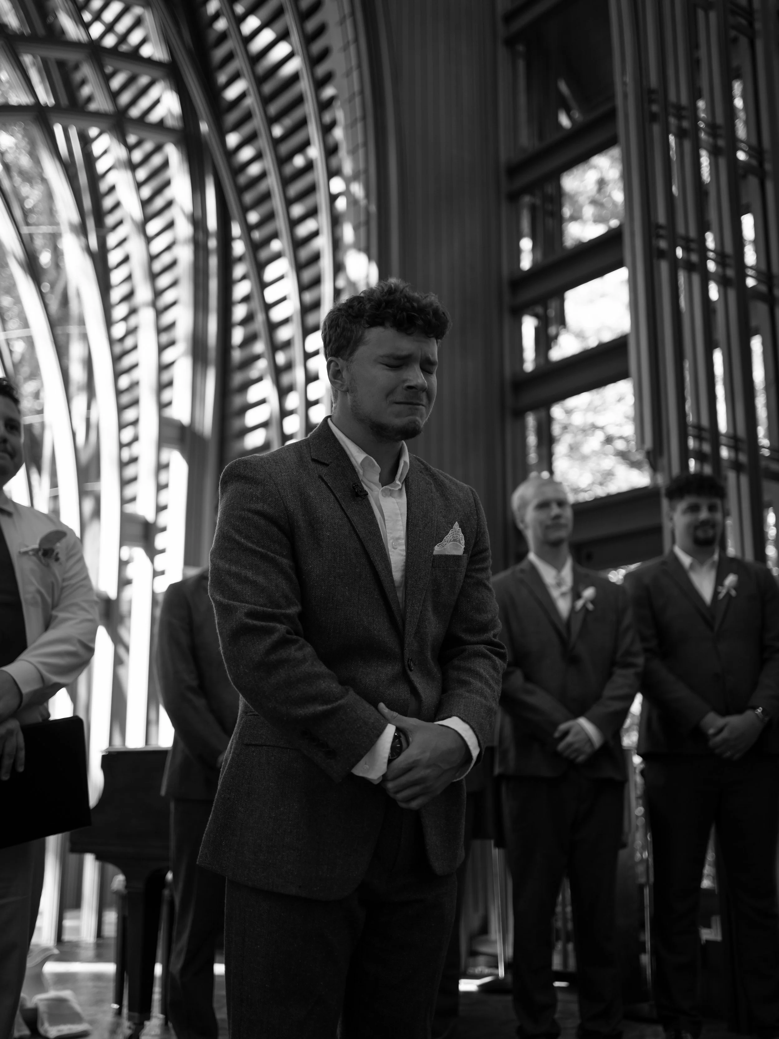 Groom reaction to bride walking down aisle at Mildred B. Cooper Memorial Chapel in Bella Vista, Arkansas