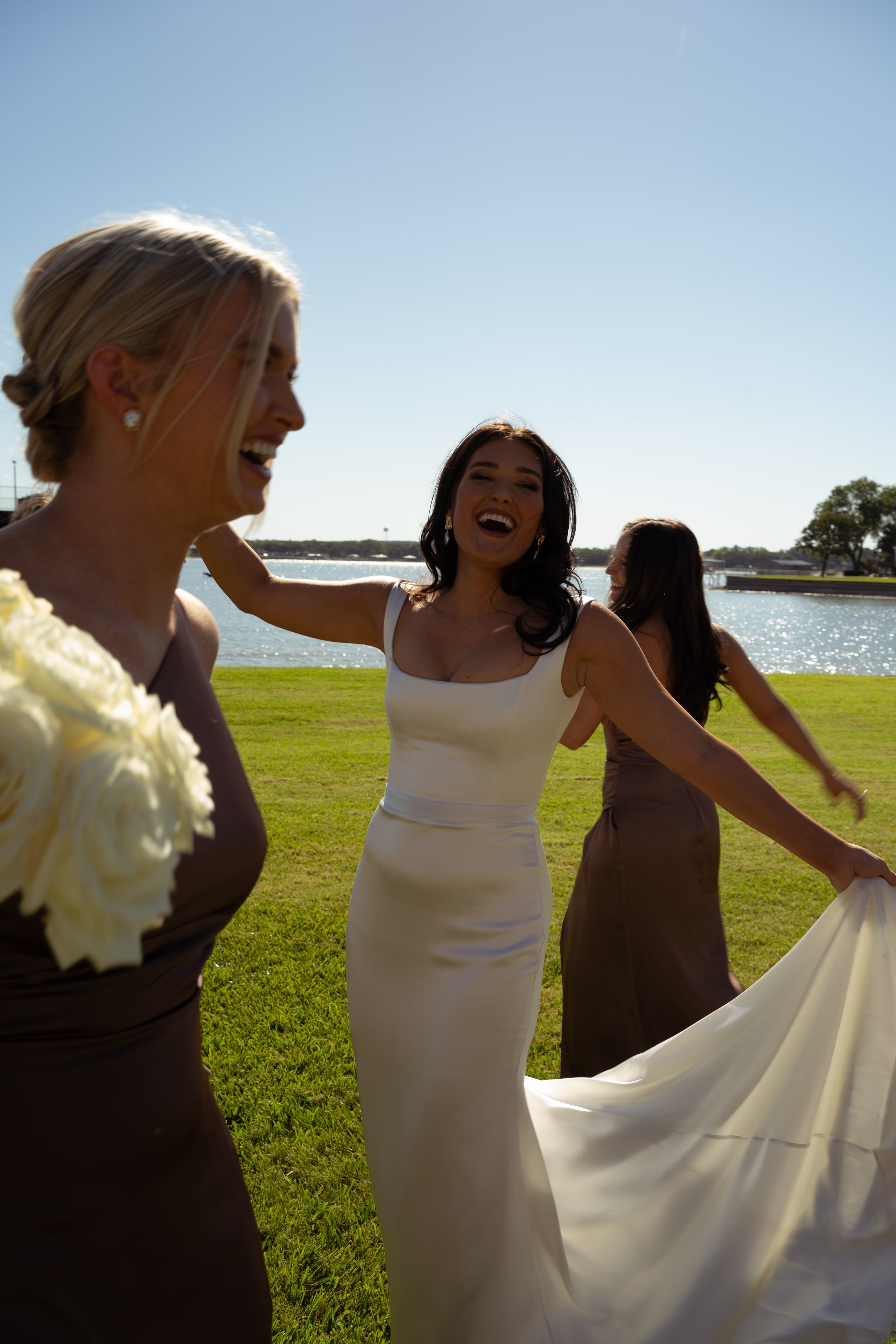 Bride and bridesmaids celebrating outside
