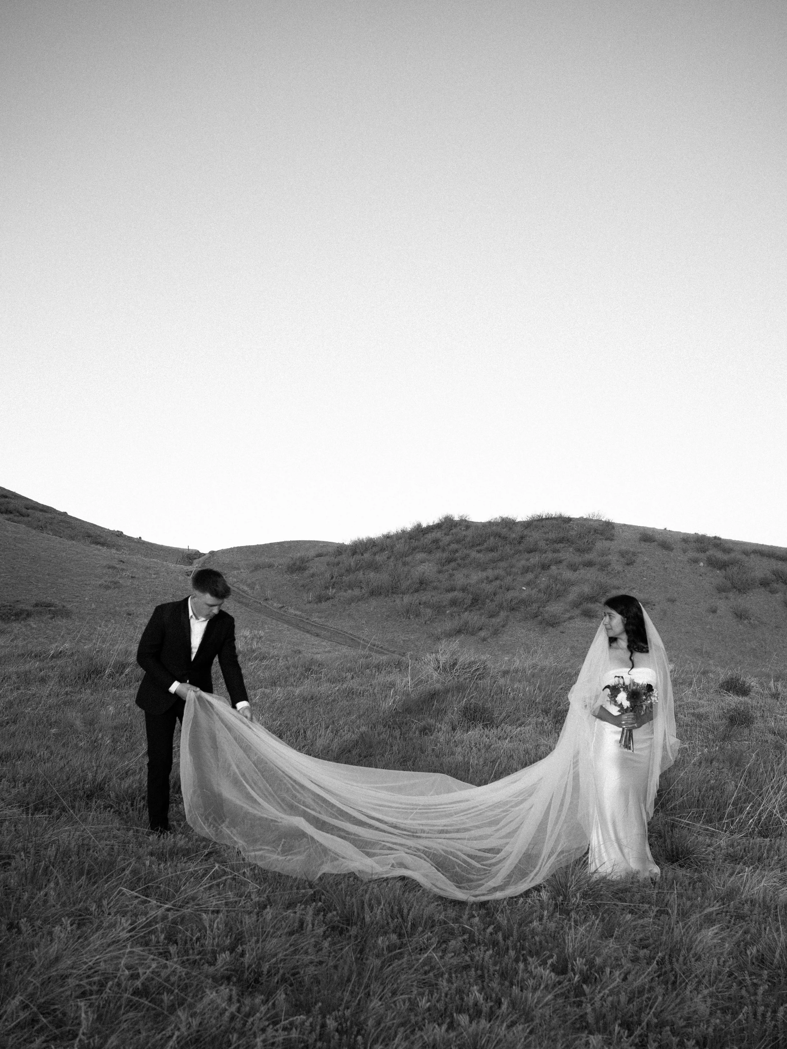 cinematic black-and-white moment in Boulder, CO, capturing movement and scale across the hills.