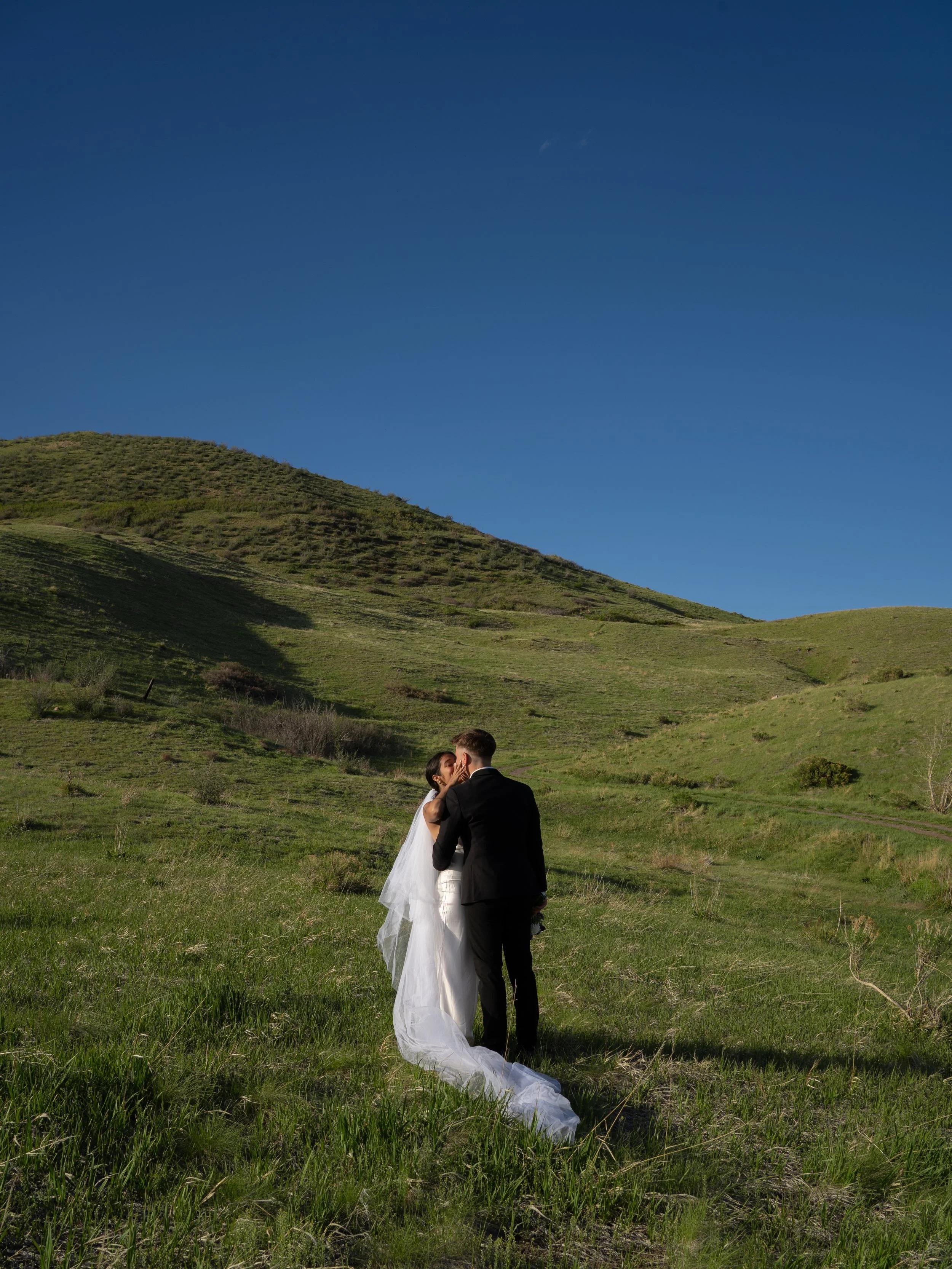 A soft and expansive portrait in Boulder, Colorado, capturing intimacy within the surrounding landscape.