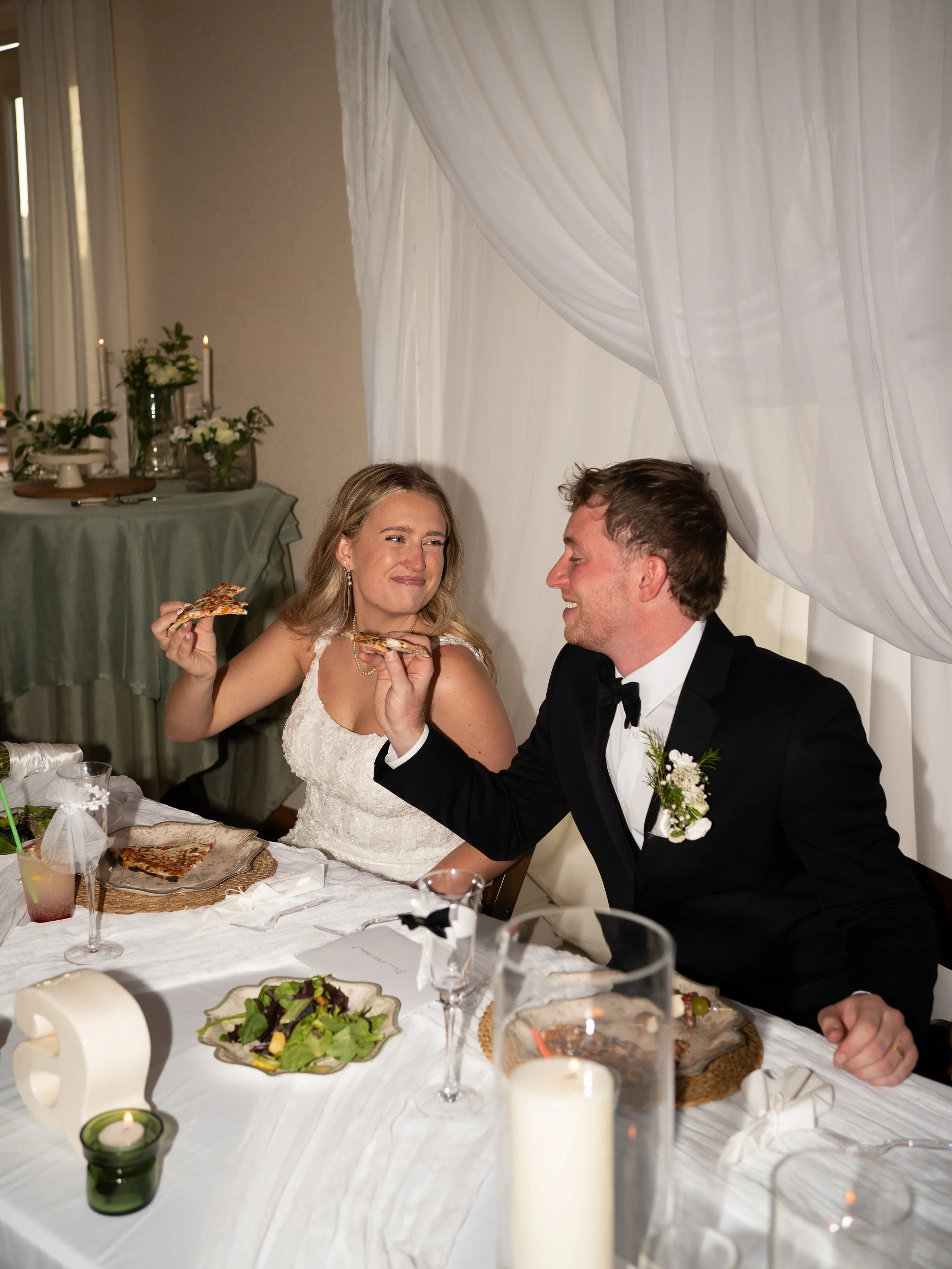 A candid reception moment in Woodland Park, CO, capturing laughter and connection during a toast.