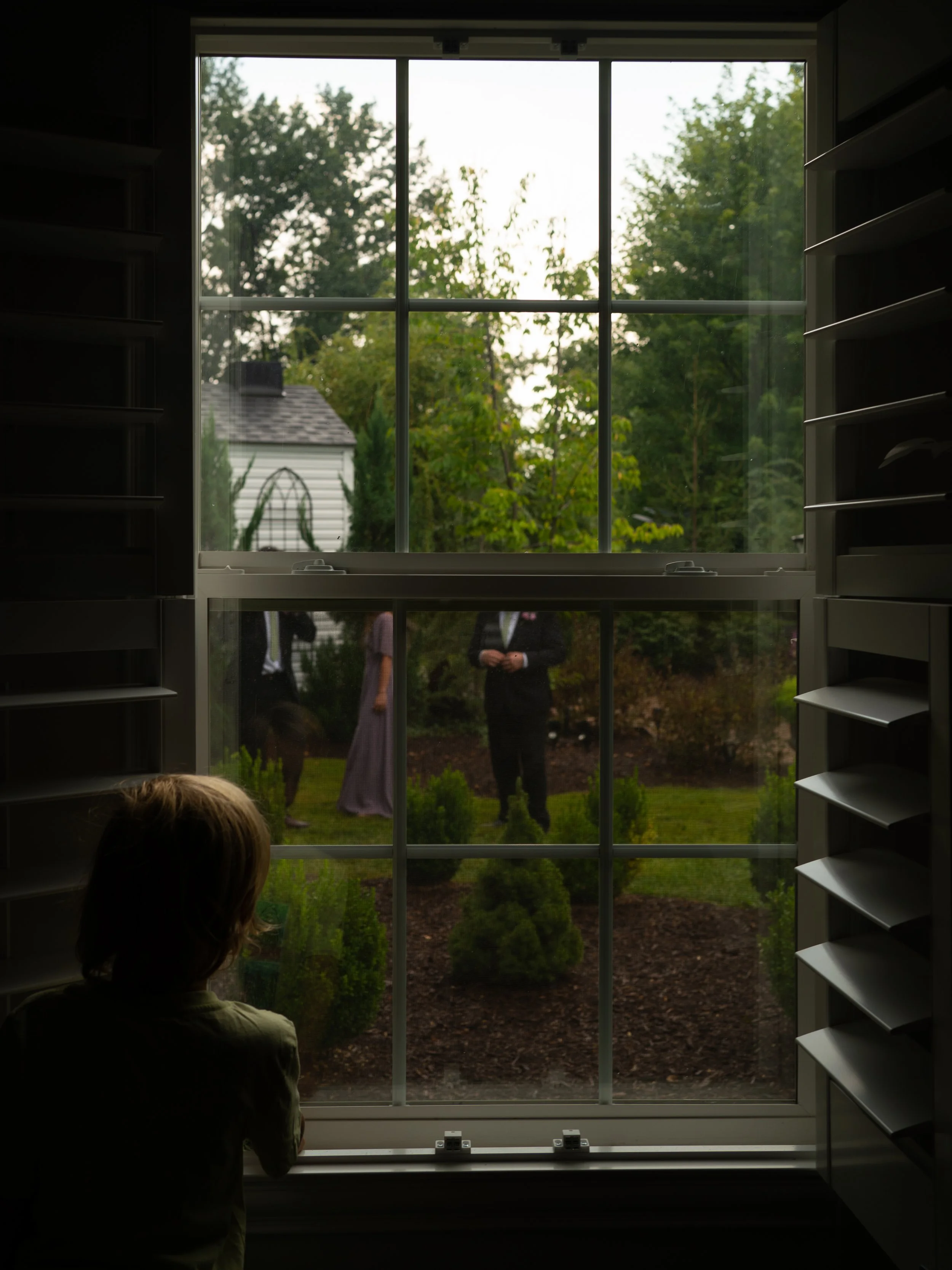 A creative, layered moment in O’Fallon, Missouri, capturing anticipation through reflection and framing.